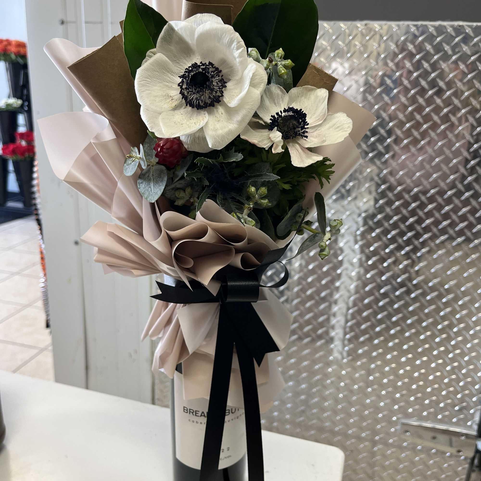 bottle not included!!! 
perfect unique floral topper to elevate a gift bottle;