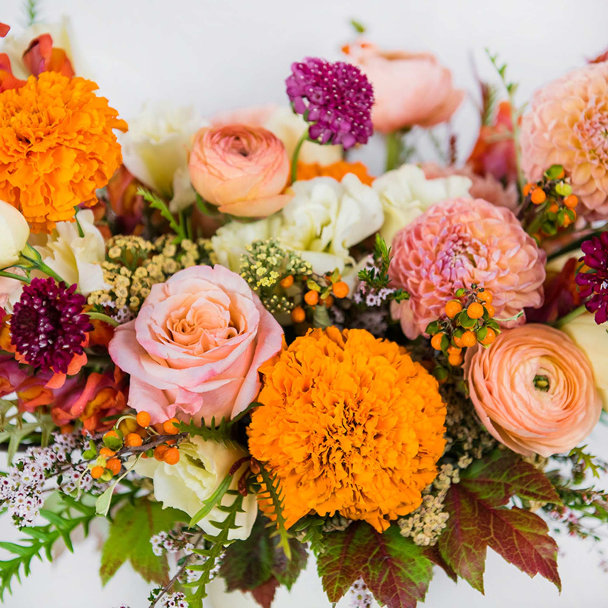 Bring the rich beauty of fall indoors with our Autumn Sunset arrangement.