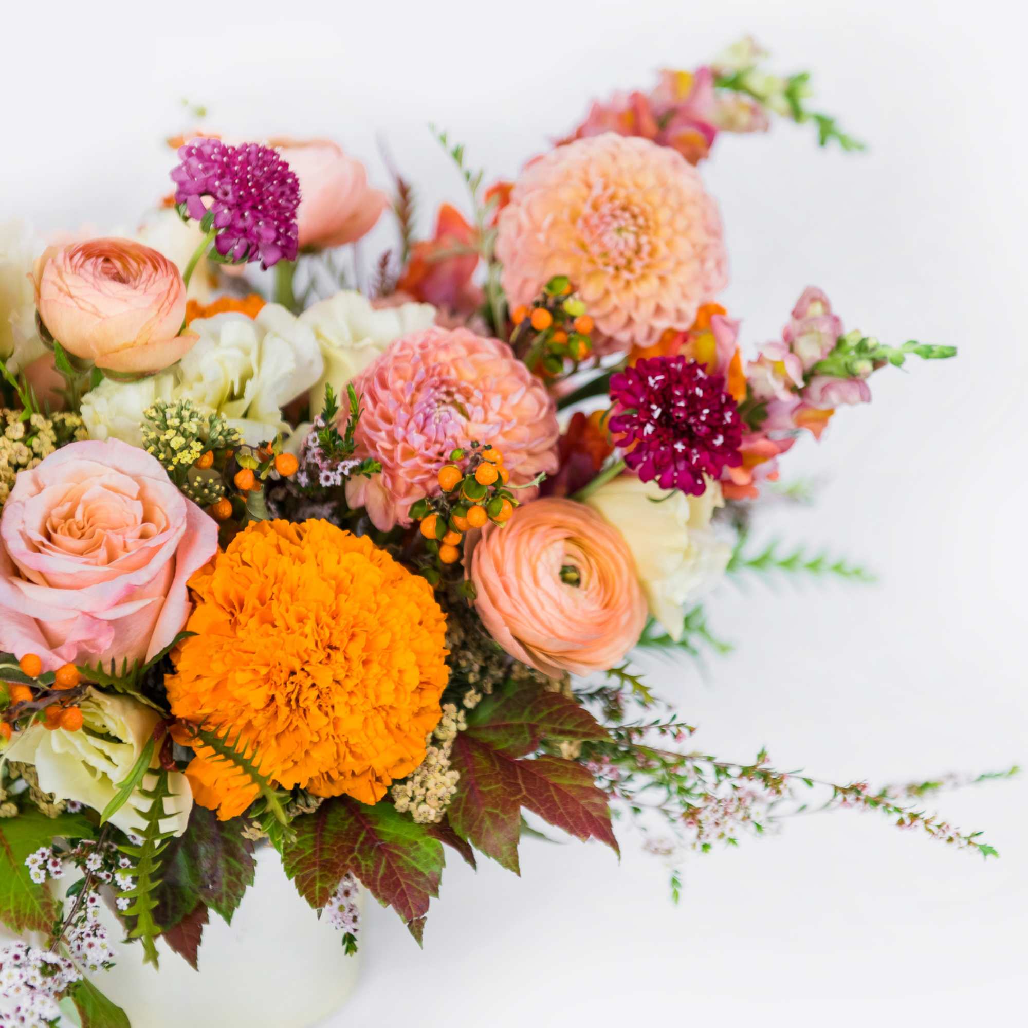 Bring the rich beauty of fall indoors with our Autumn Sunset arrangement.