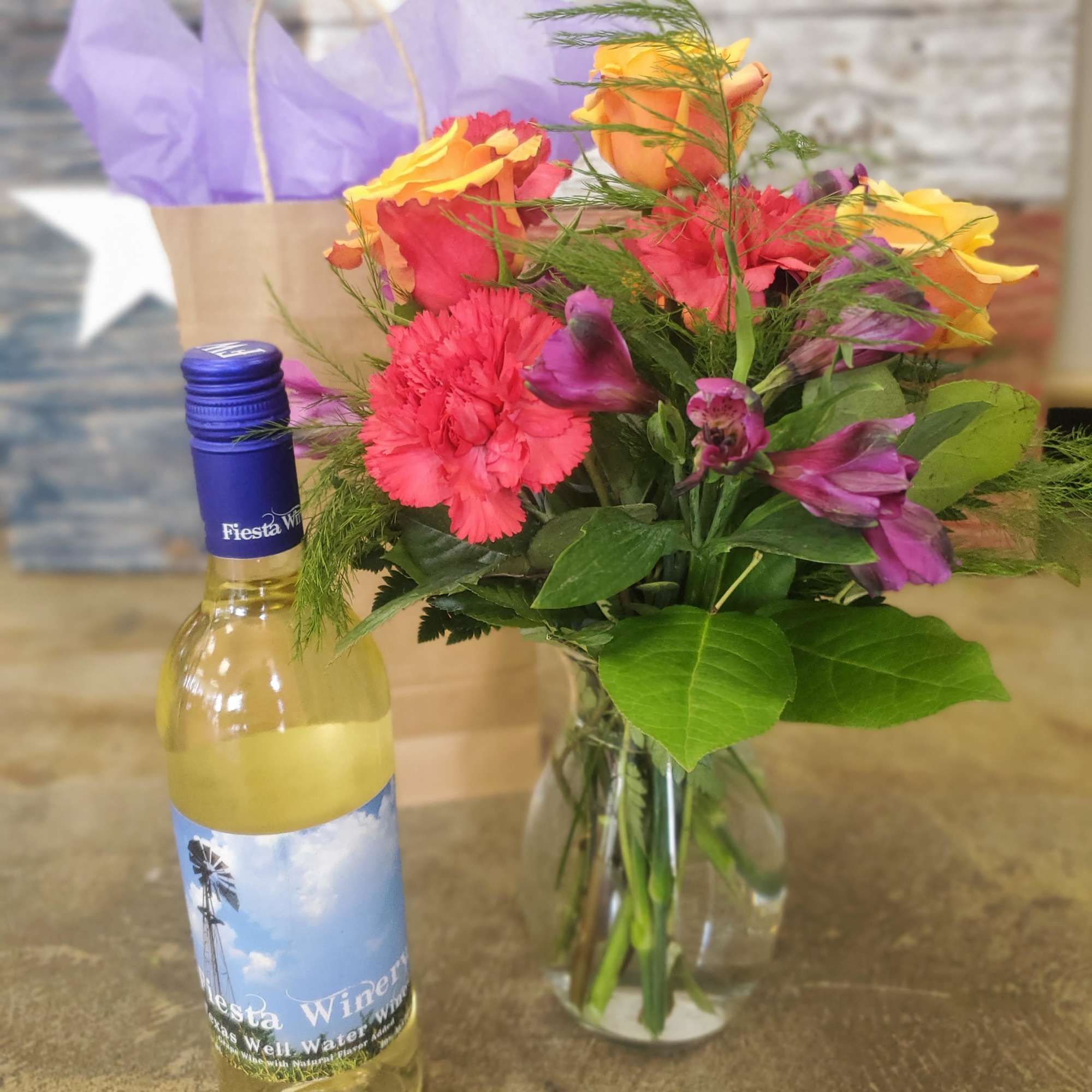 One bottle of wine with a Designer's Choice Bouquet to match. Let One bottle of wine with a Designer's Choice Bouquet to match. Let
