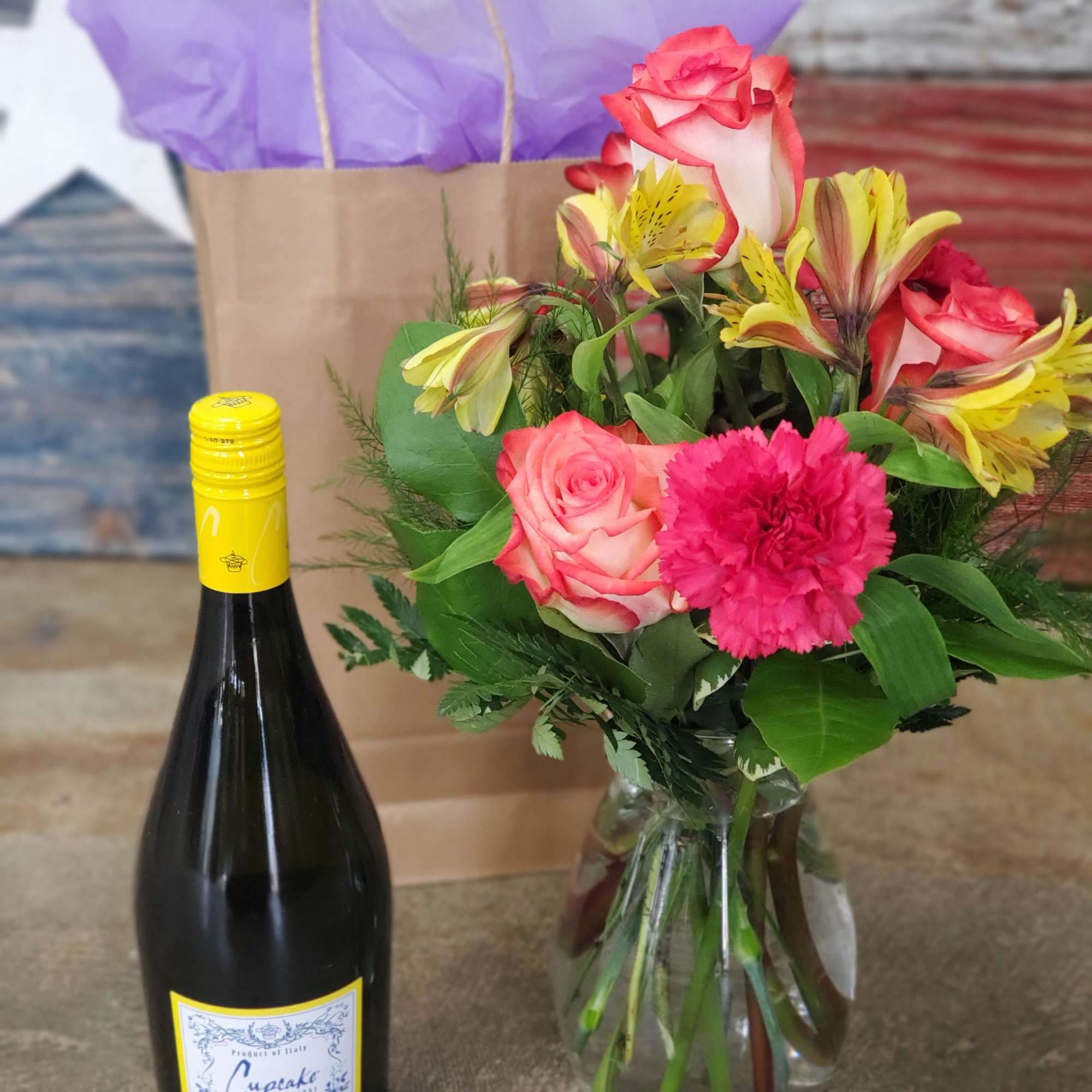 One bottle of wine with a Designer's Choice Bouquet to match. Let One bottle of wine with a Designer's Choice Bouquet to match. Let