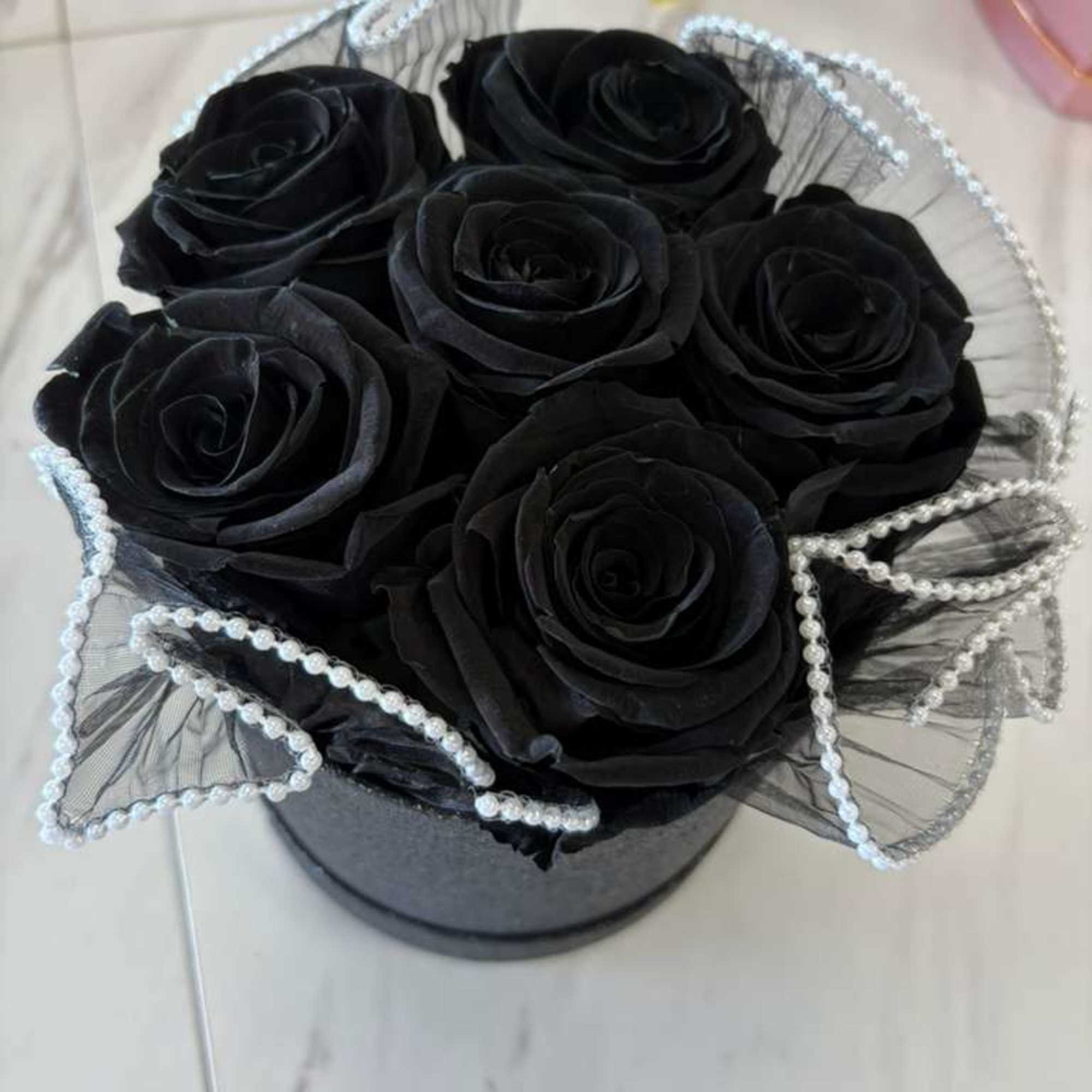 
Discover the unique beauty of our black eternal roses, a symbol of