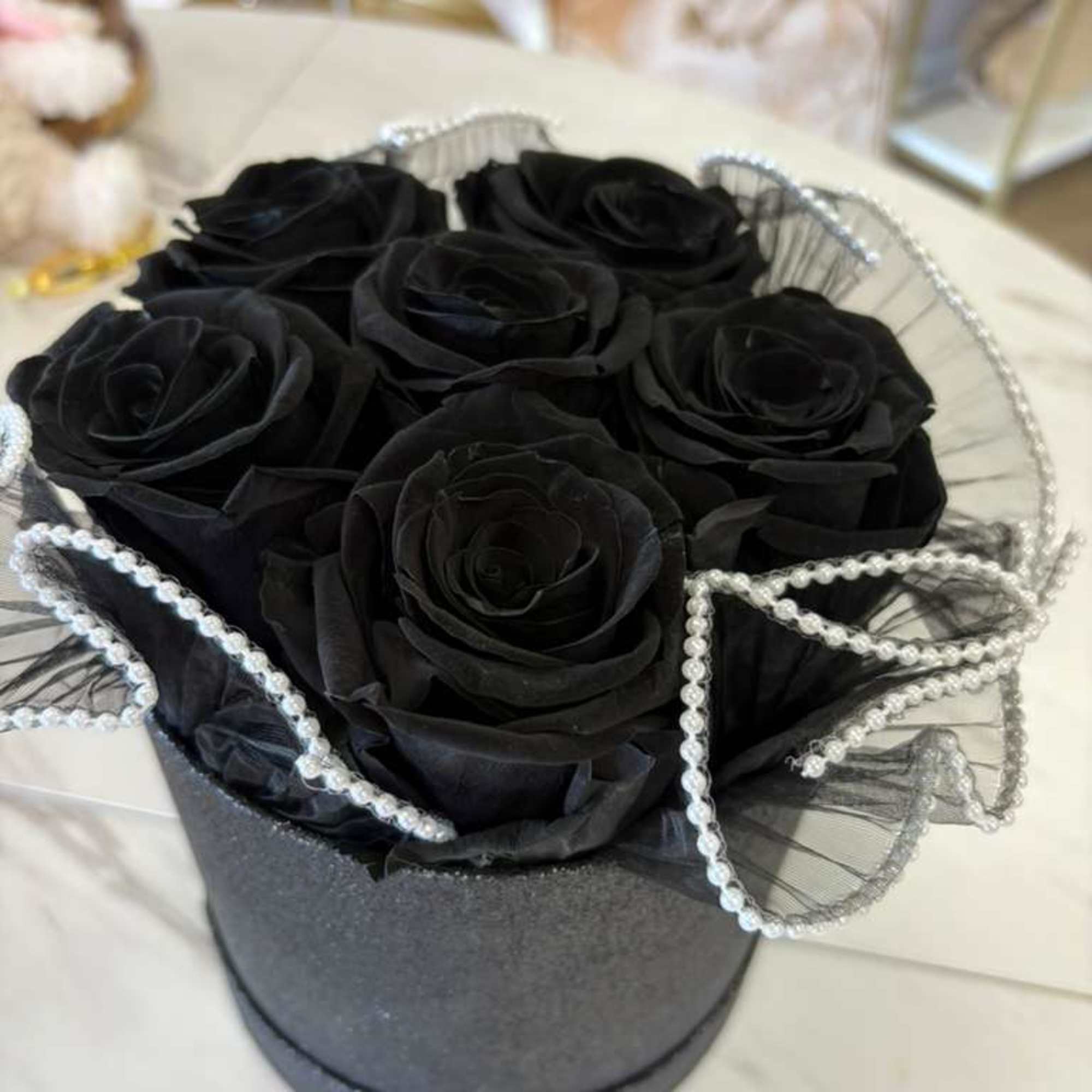 
Discover the unique beauty of our black eternal roses, a symbol of