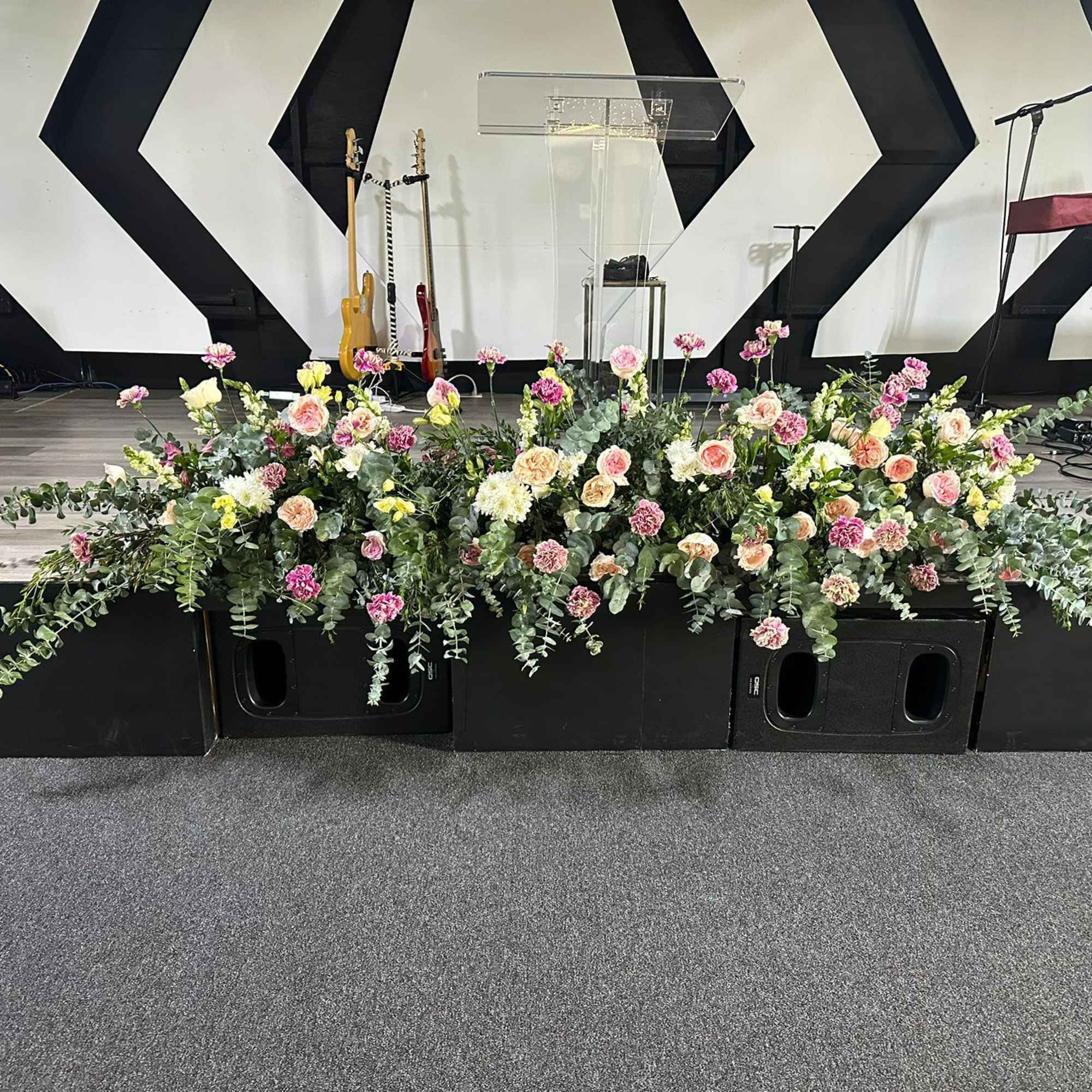 A delicate floral path enhances the beauty of the ceremony. Composed of