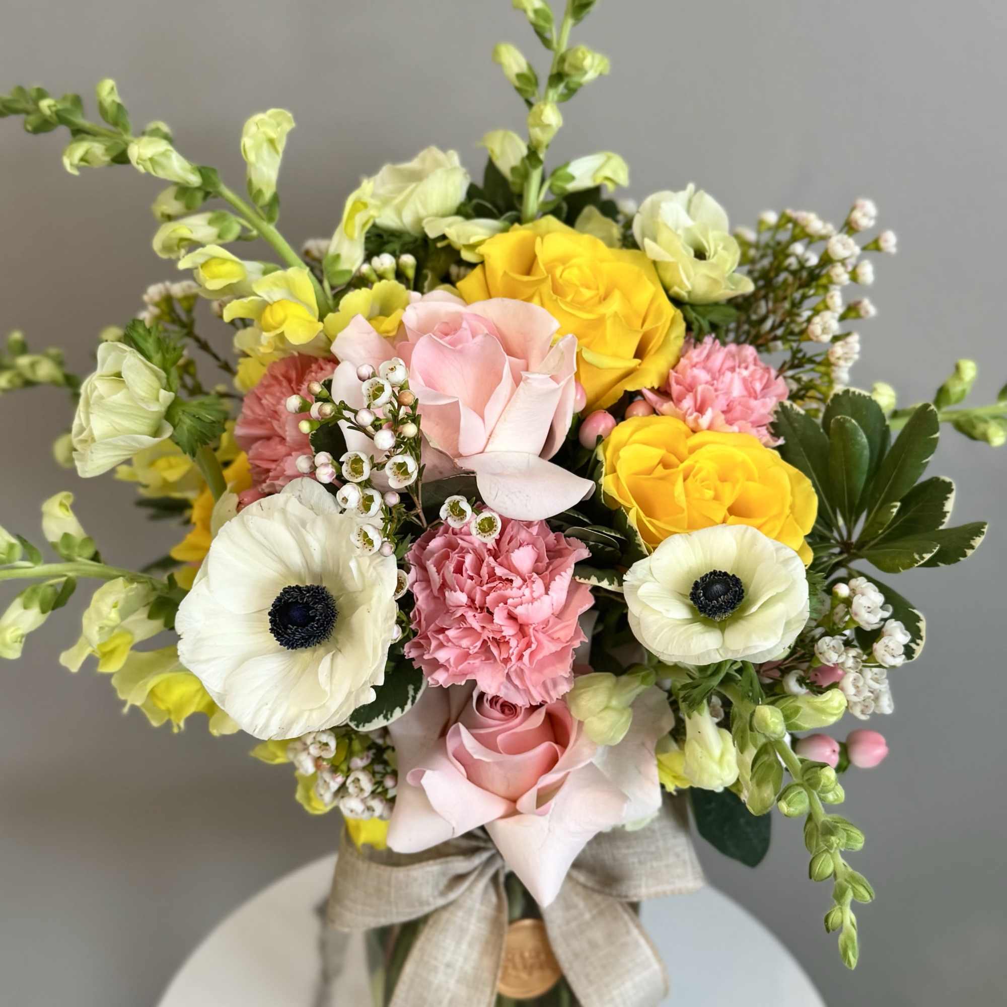 A one-of-a-kind arrangement designed with the freshest seasonal blooms, thoughtfully crafted to