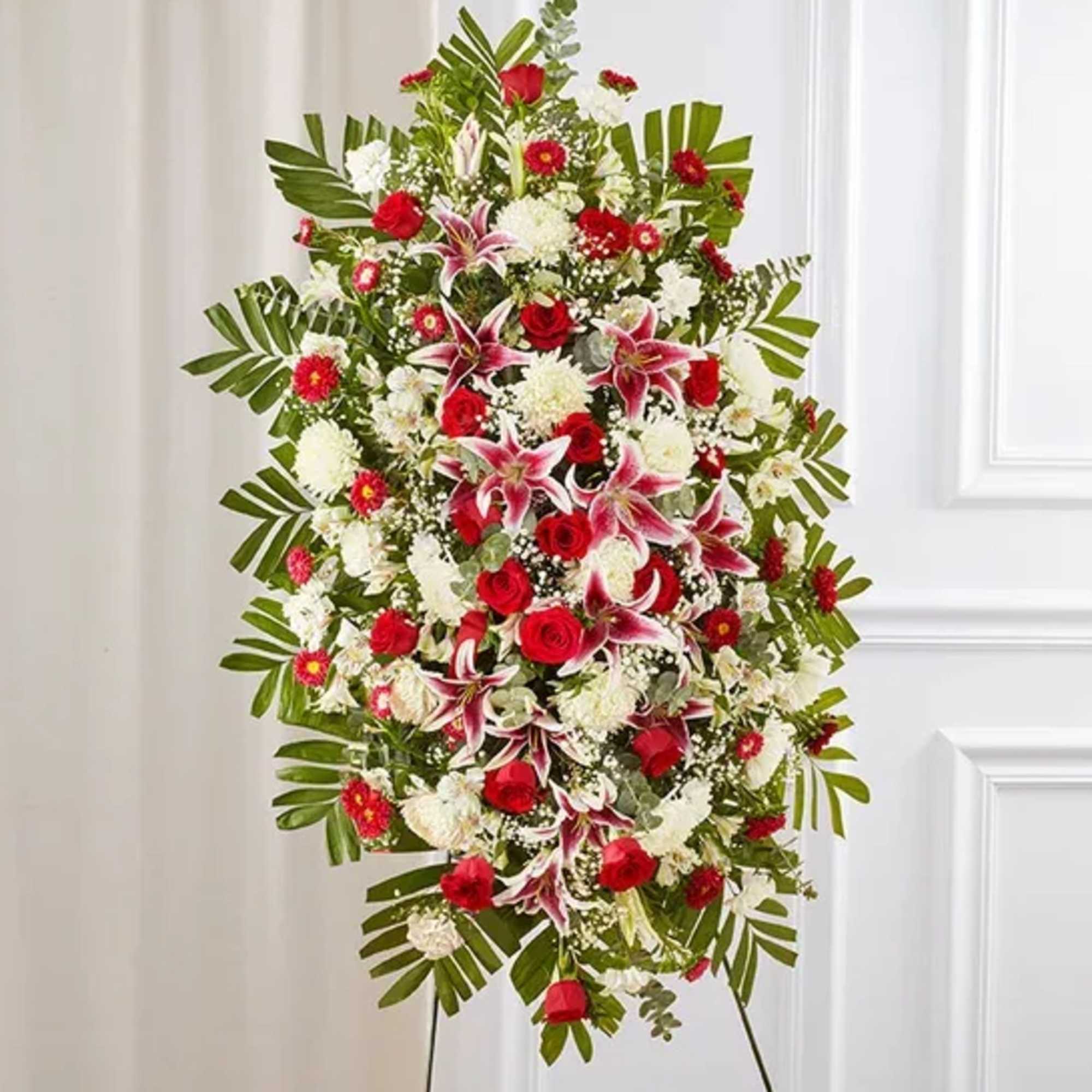 Our sophisticated and elegant standing sympathy spray is arranged with rich and