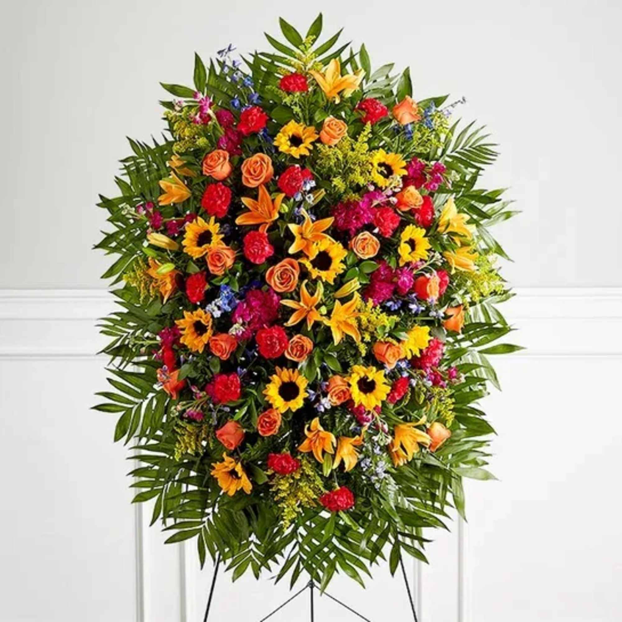 Elegantly crafted for a lush, full presentation, this vibrant mix of blooms