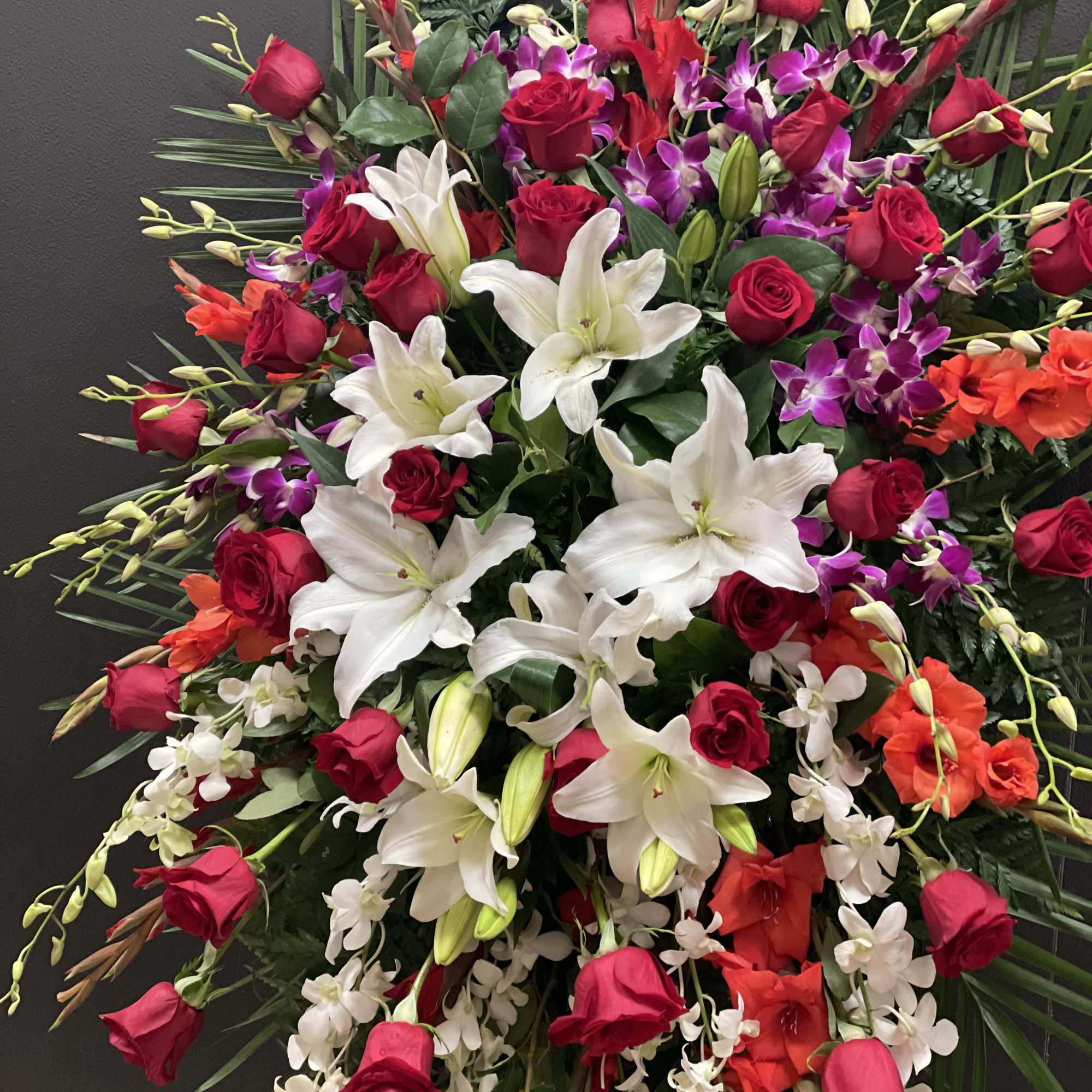 This Grand and Beautiful standing spray, made with purple and white dendrobium