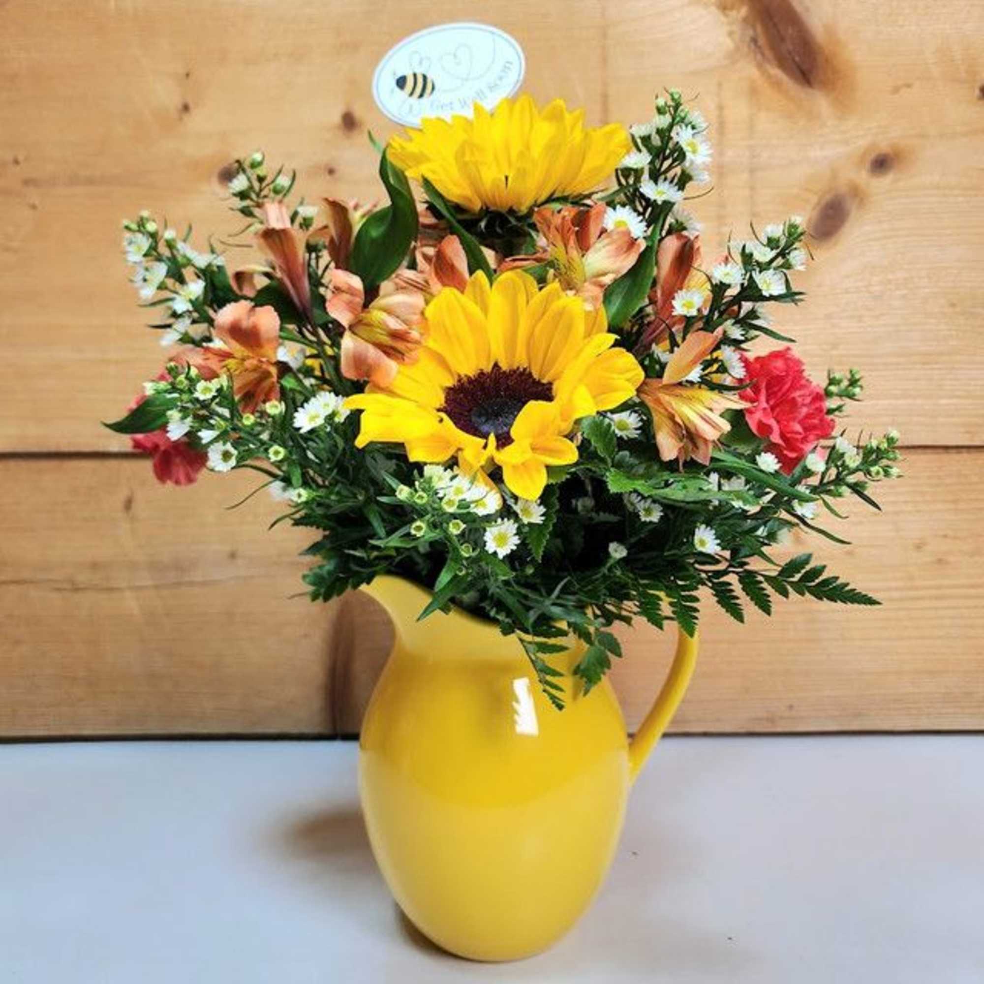 The &quot;Bee Well Bouquet&quot; is a cheerful and vibrant floral arrangement designed