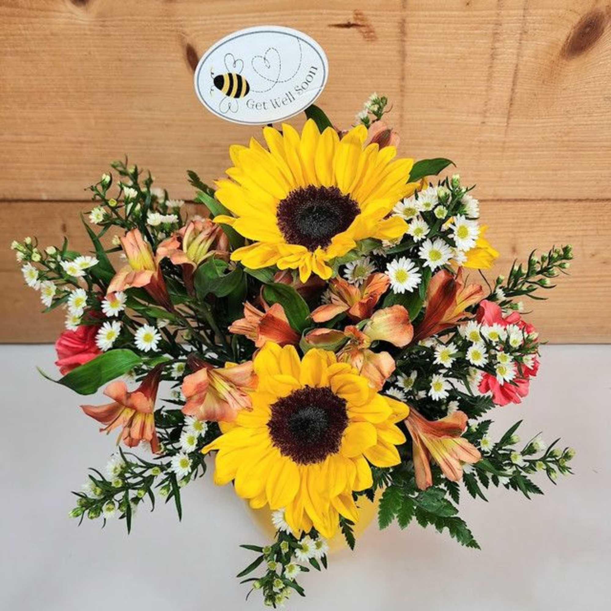 The &quot;Bee Well Bouquet&quot; is a cheerful and vibrant floral arrangement designed