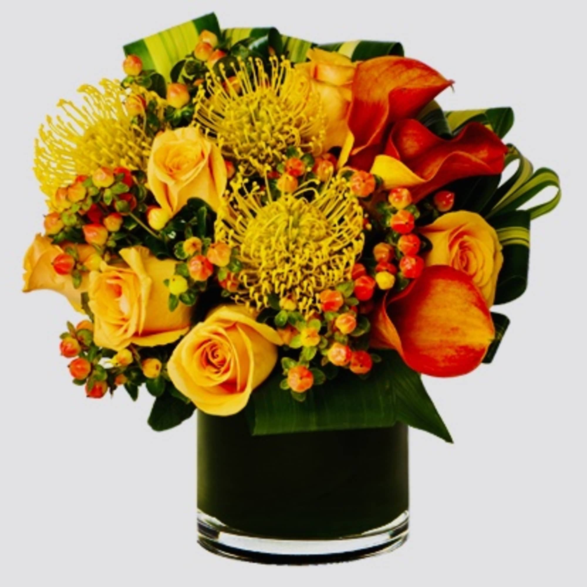 Rich, elegant, and full of vibrant color, this stunning arrangement features a