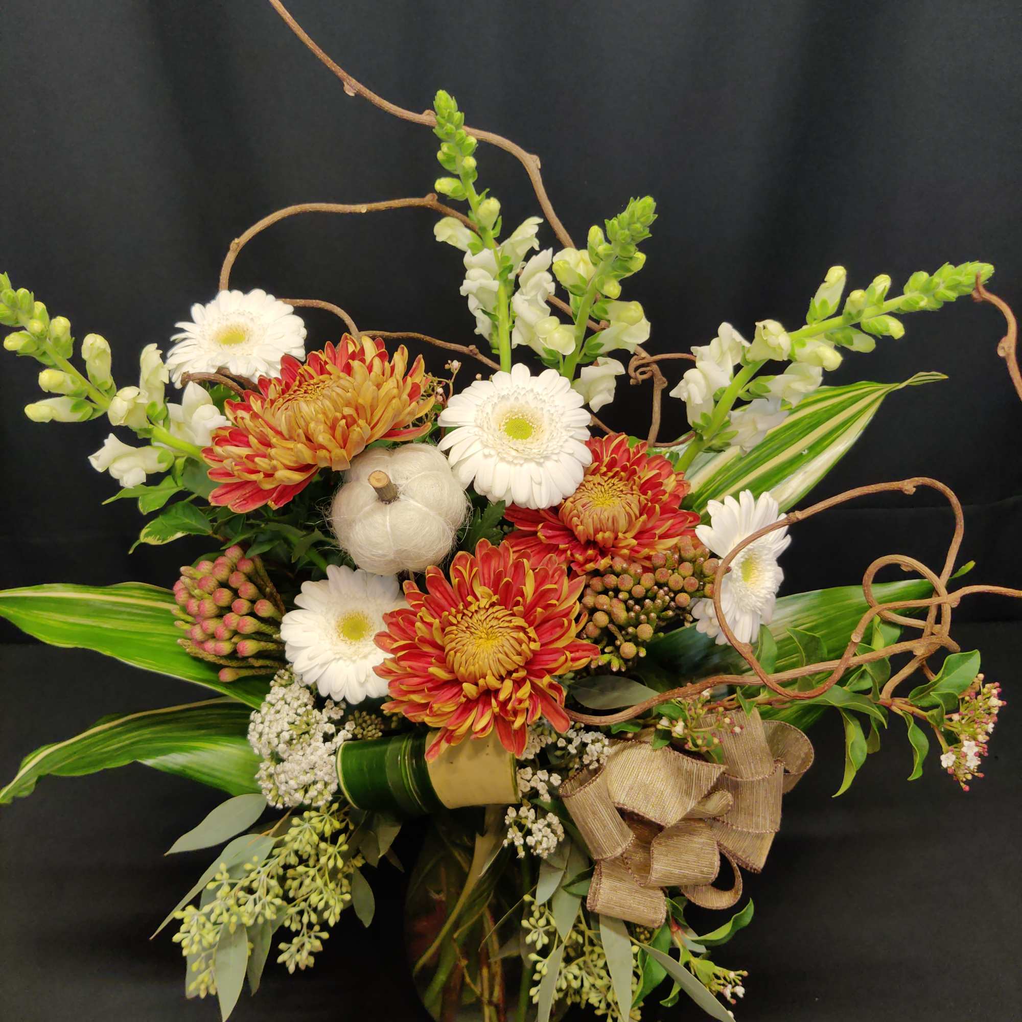 Rich autumn tones are striking against this White bouquet for fall. Accents