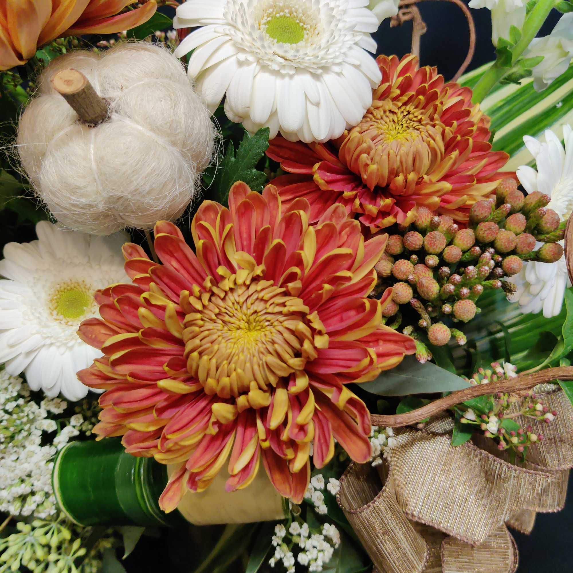 Rich autumn tones are striking against this White bouquet for fall. Accents