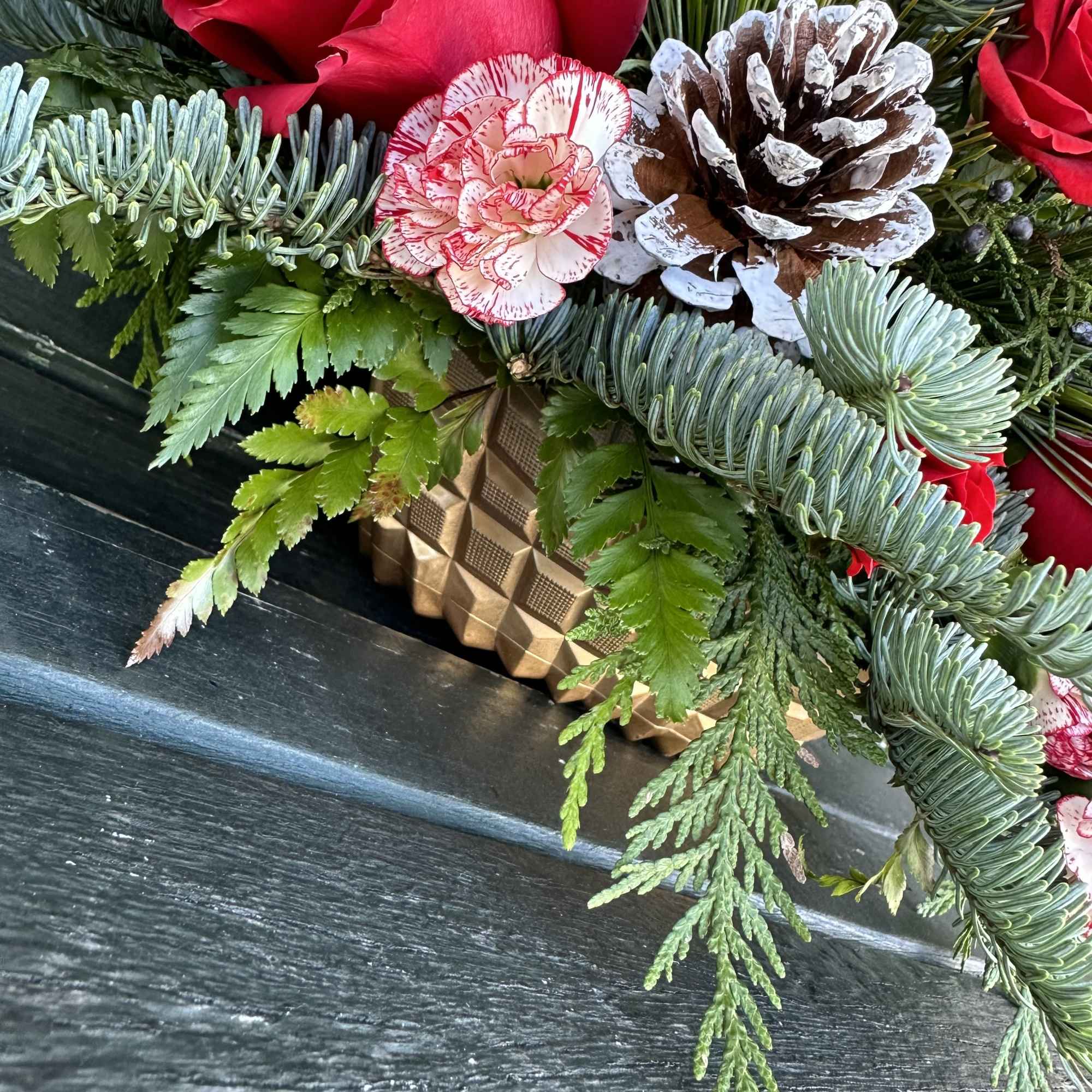 Beautiful seasonal centerpiece with fresh cut flowers and christmas greens. Size 22&ldquo;