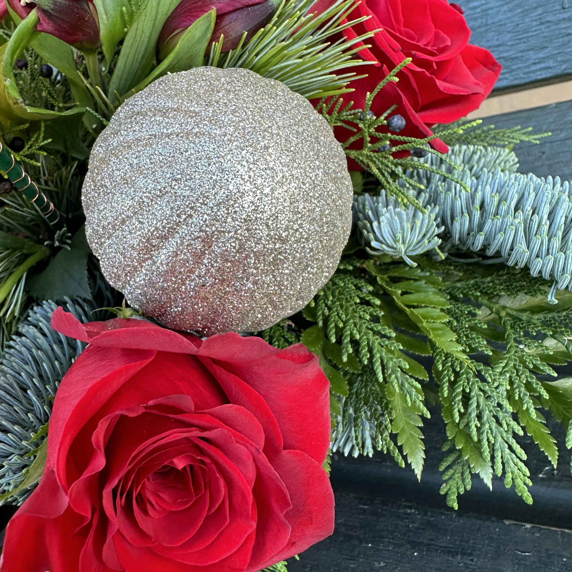 Beautiful seasonal centerpiece with fresh cut flowers and christmas greens. Size 22&ldquo;