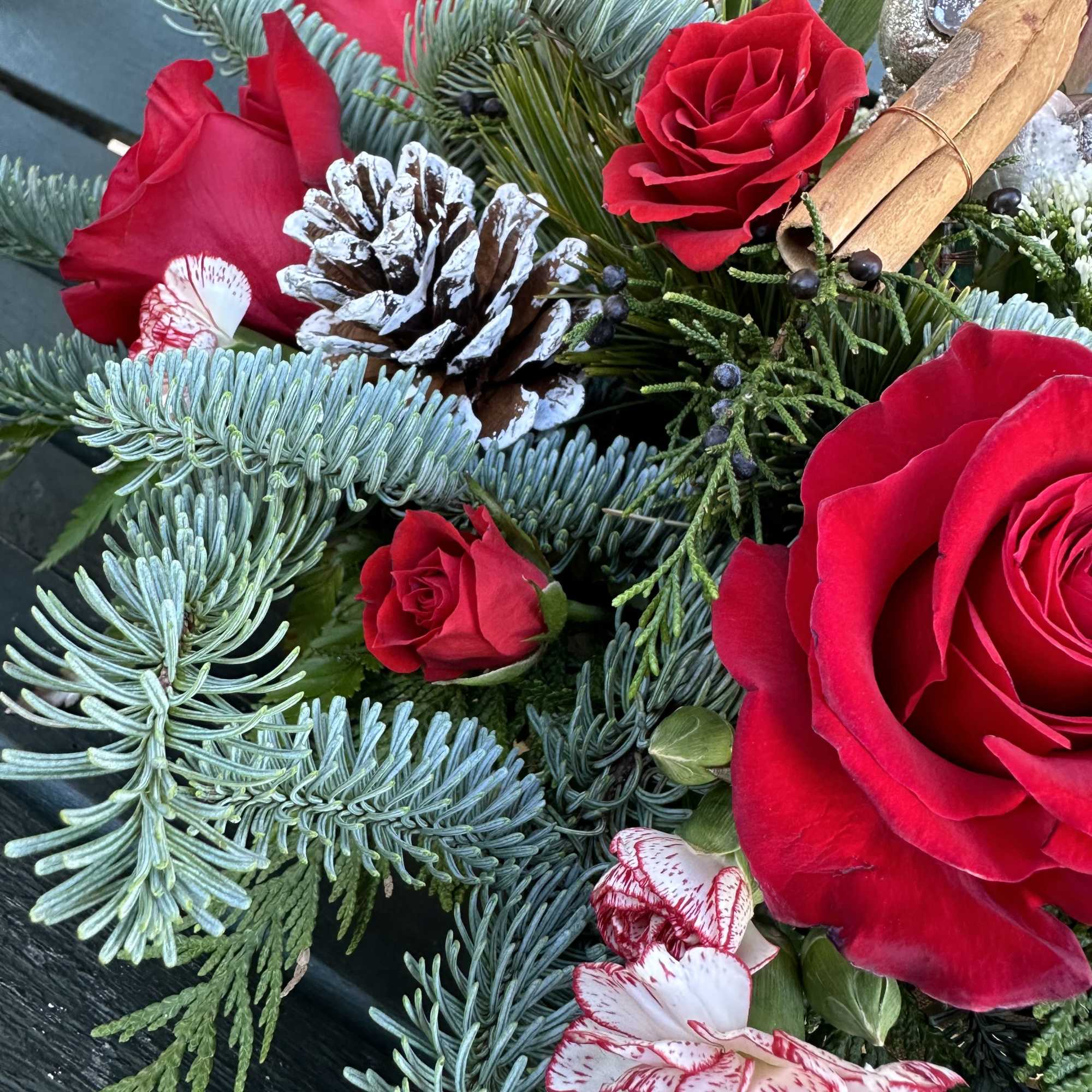 Beautiful seasonal centerpiece with fresh cut flowers and christmas greens. Size 22&ldquo;