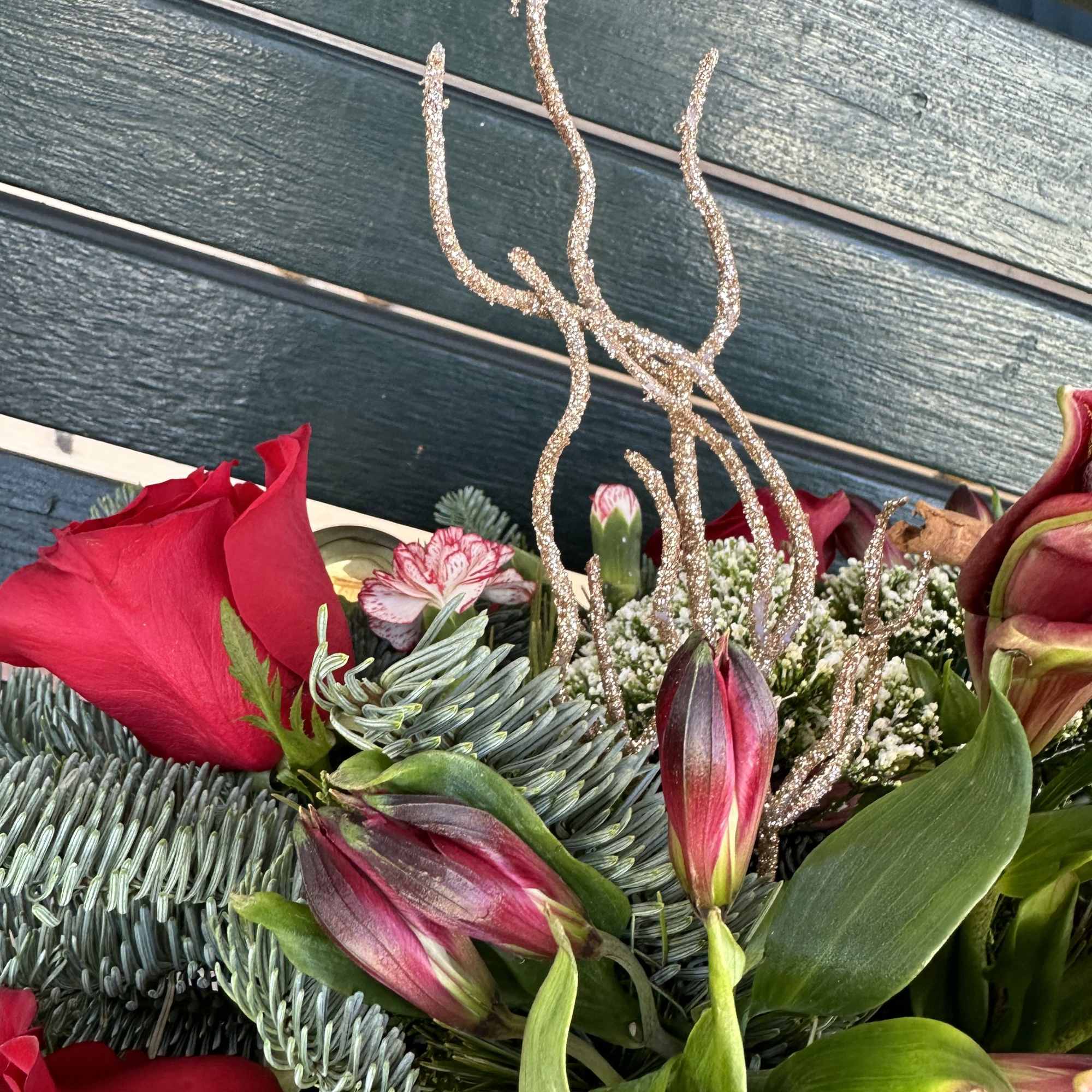 Beautiful seasonal centerpiece with fresh cut flowers and christmas greens. Size 22&ldquo;