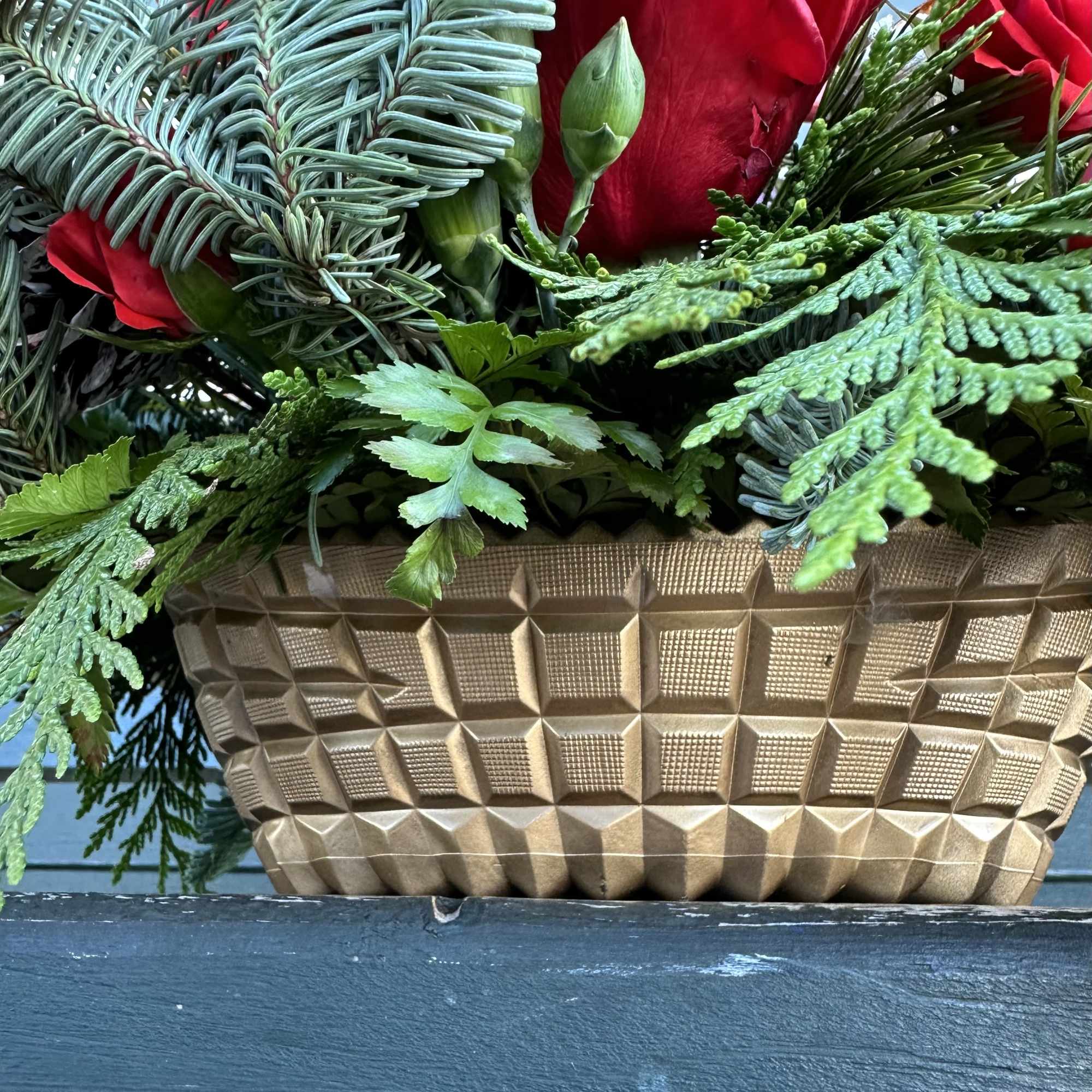 Beautiful seasonal centerpiece with fresh cut flowers and christmas greens. Size 22&ldquo;