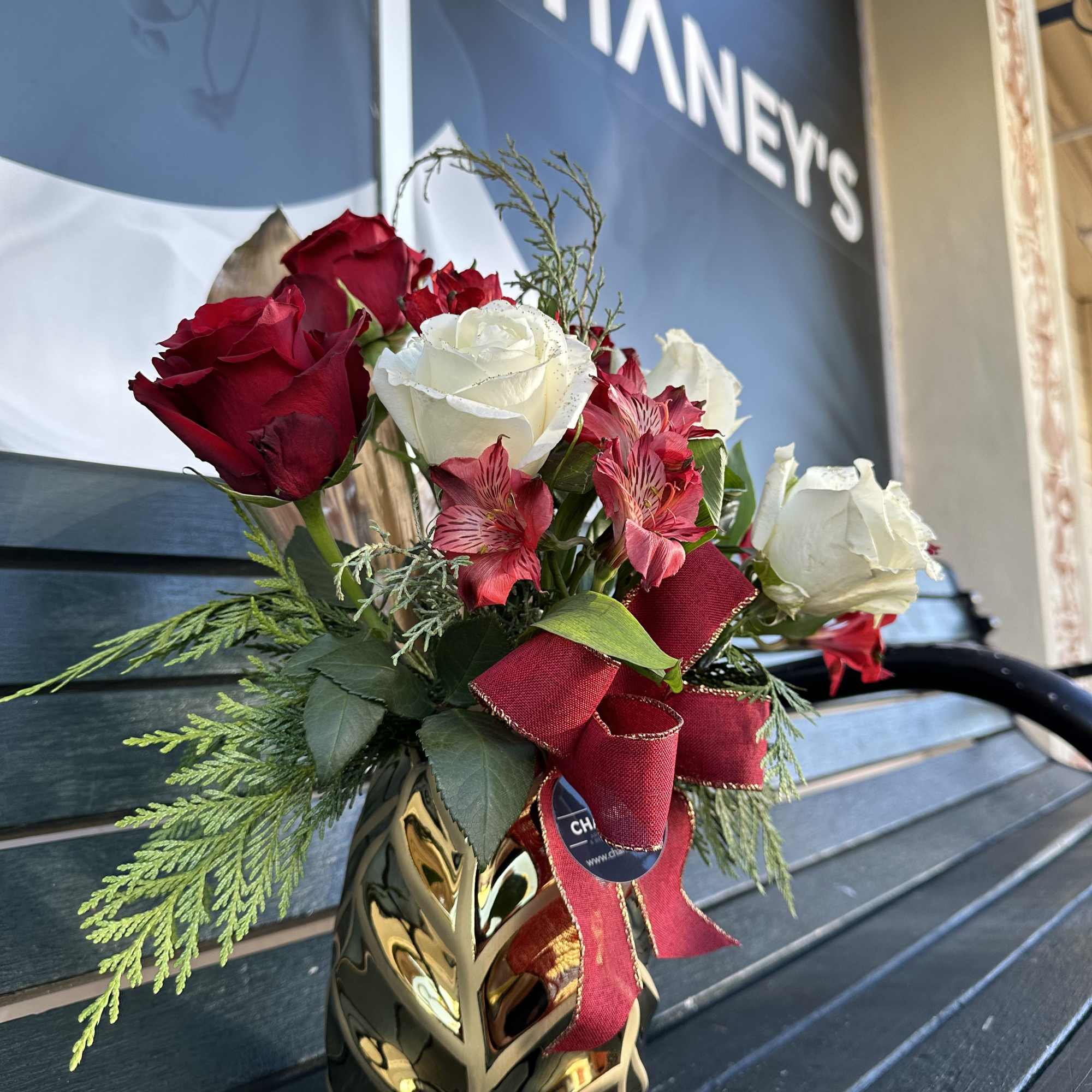 Seasonal fresh cut design in gold, red and white with fresh christmas