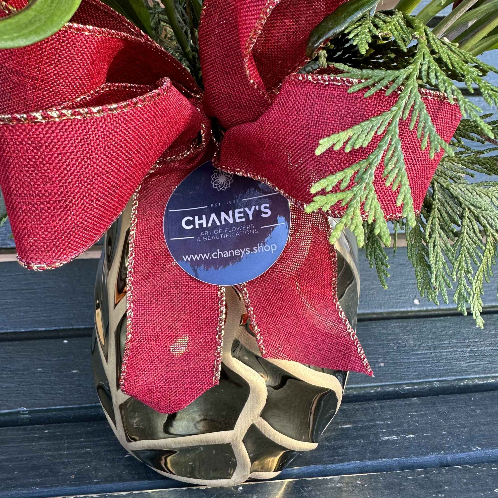 Seasonal fresh cut design in gold, red and white with fresh christmas