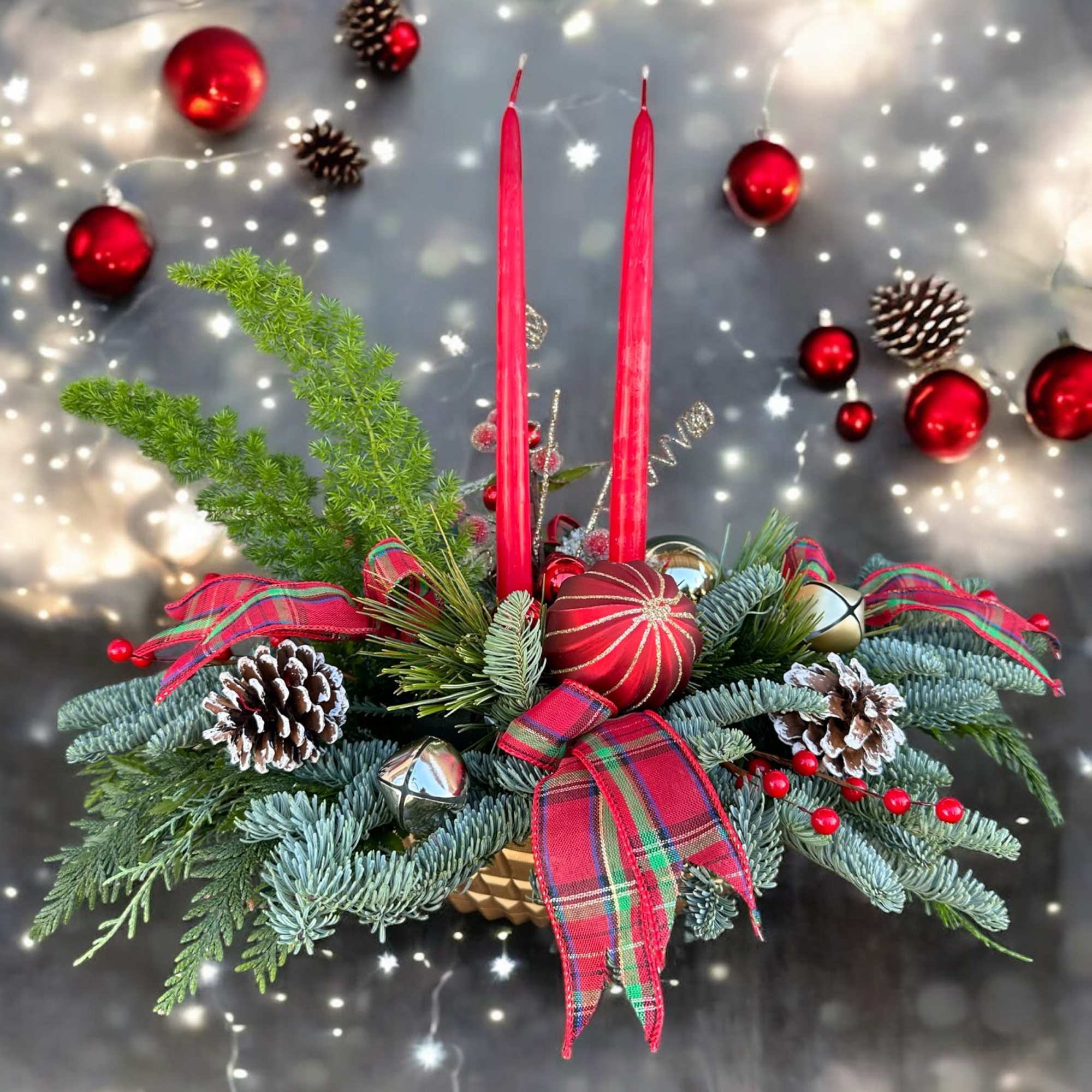 Centerpiece with fresh Christmas greens, candles and decoration. Hand arranged with love!