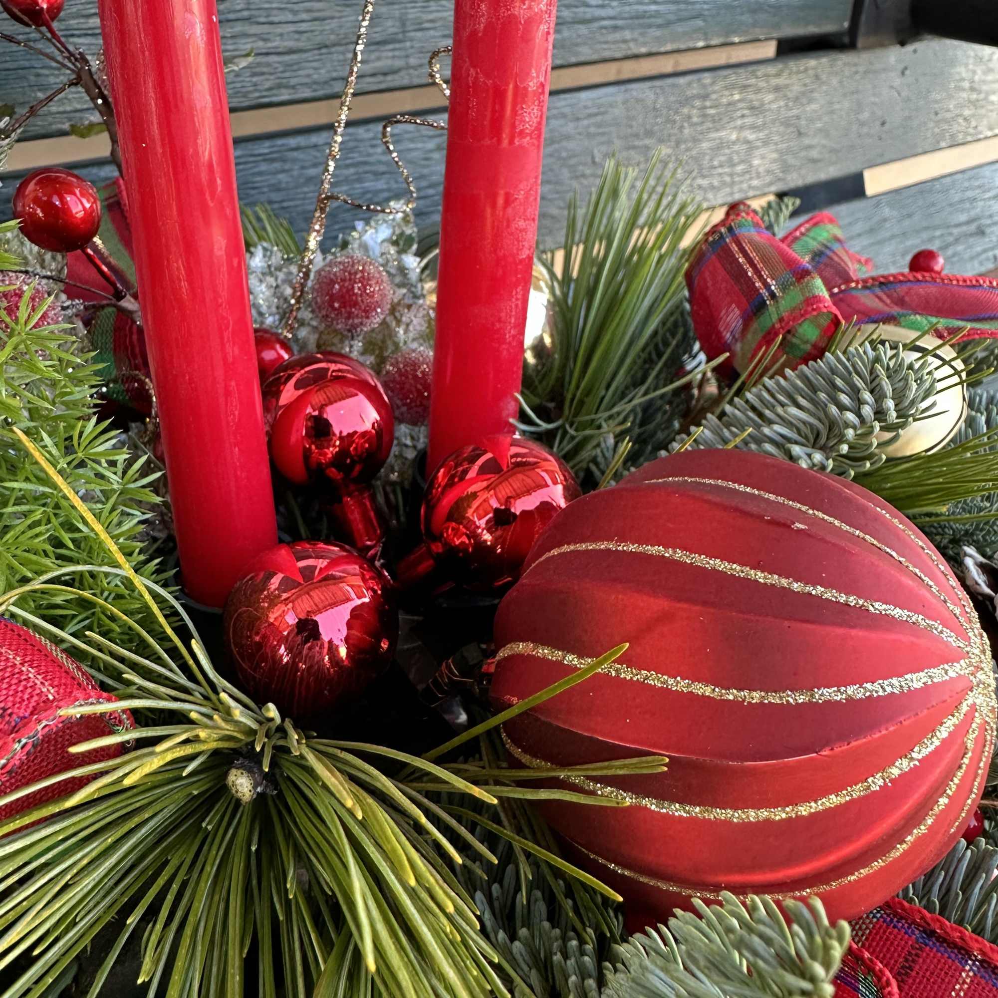 Centerpiece with fresh Christmas greens, candles and decoration. Hand arranged with love!
