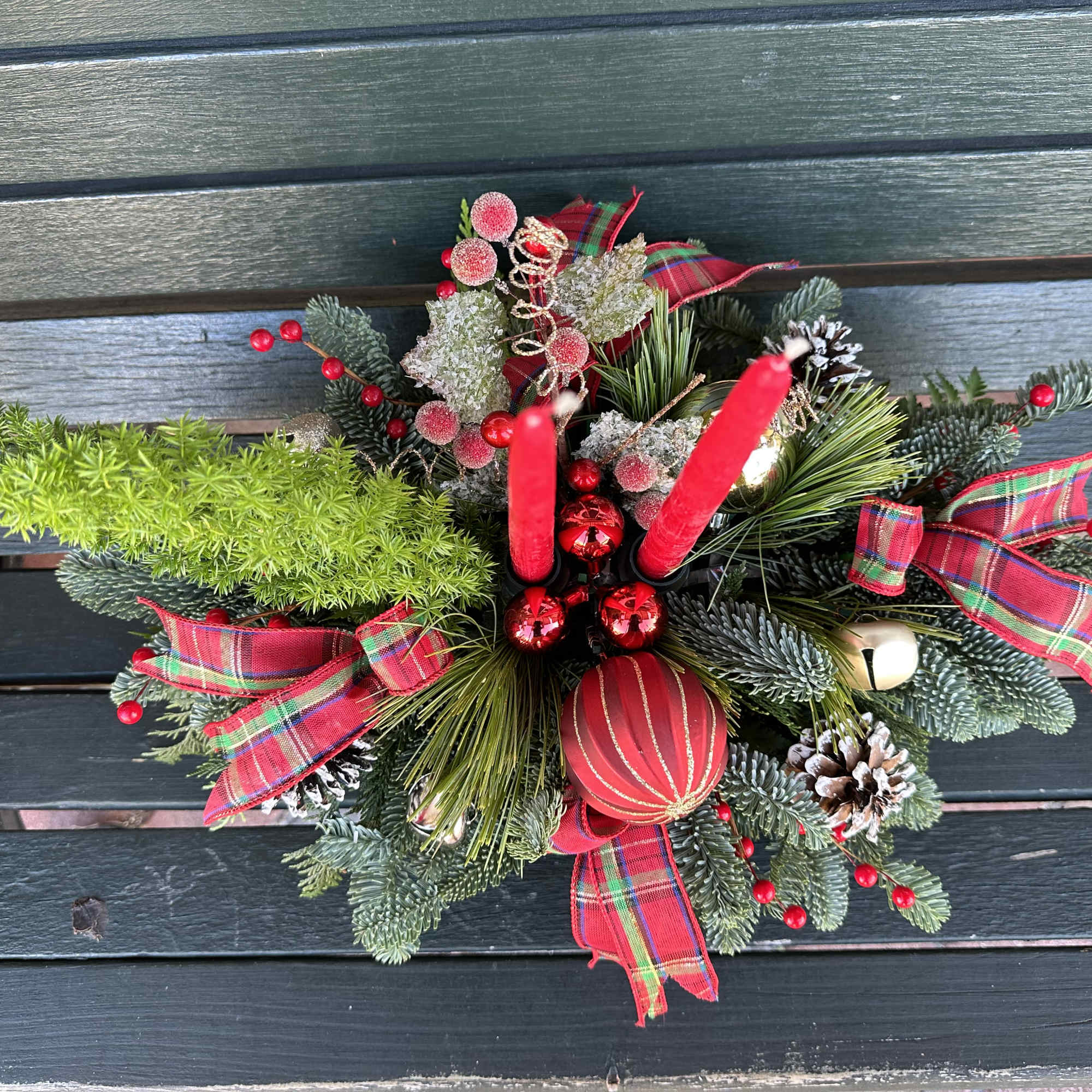Centerpiece with fresh Christmas greens, candles and decoration. Hand arranged with love!
