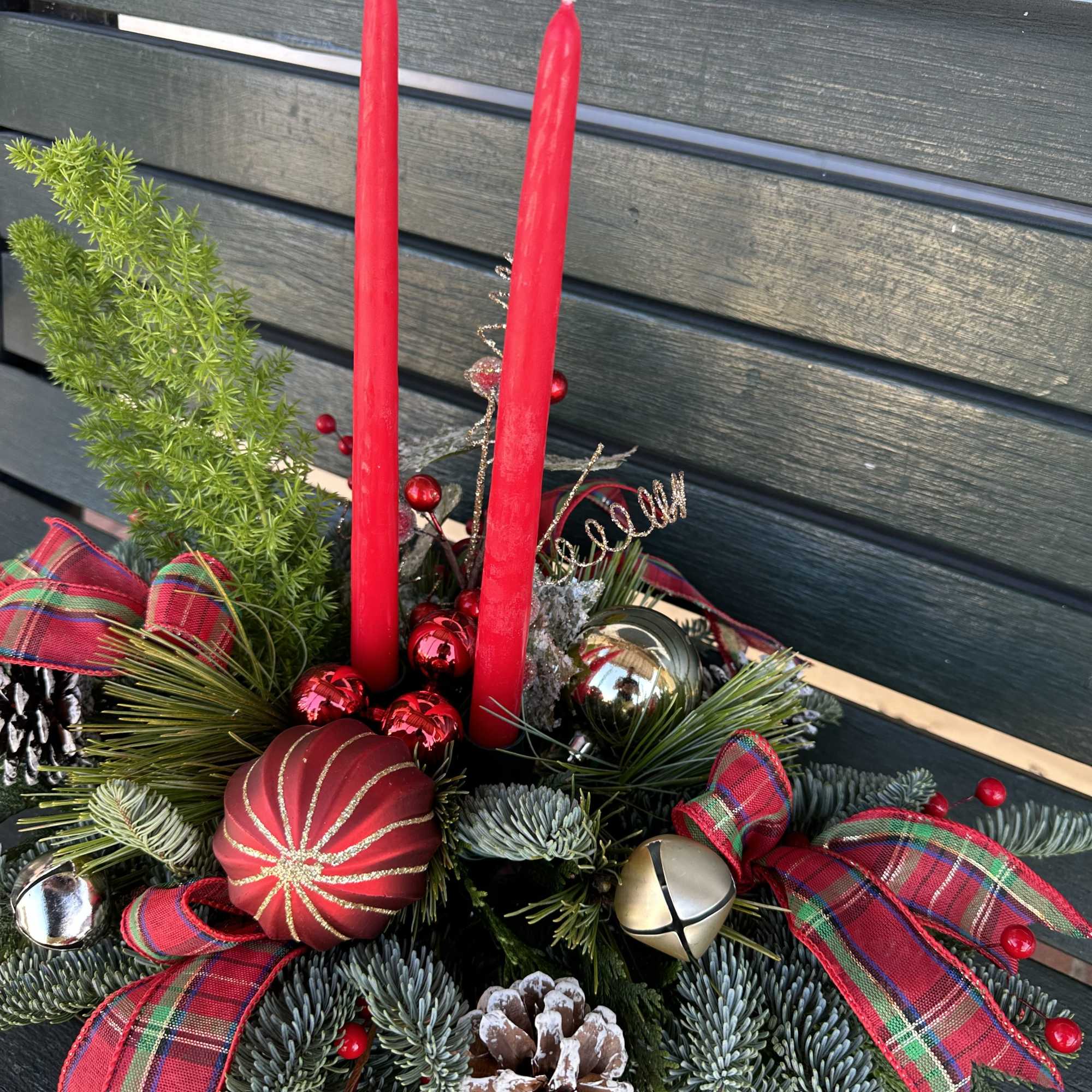 Centerpiece with fresh Christmas greens, candles and decoration. Hand arranged with love!