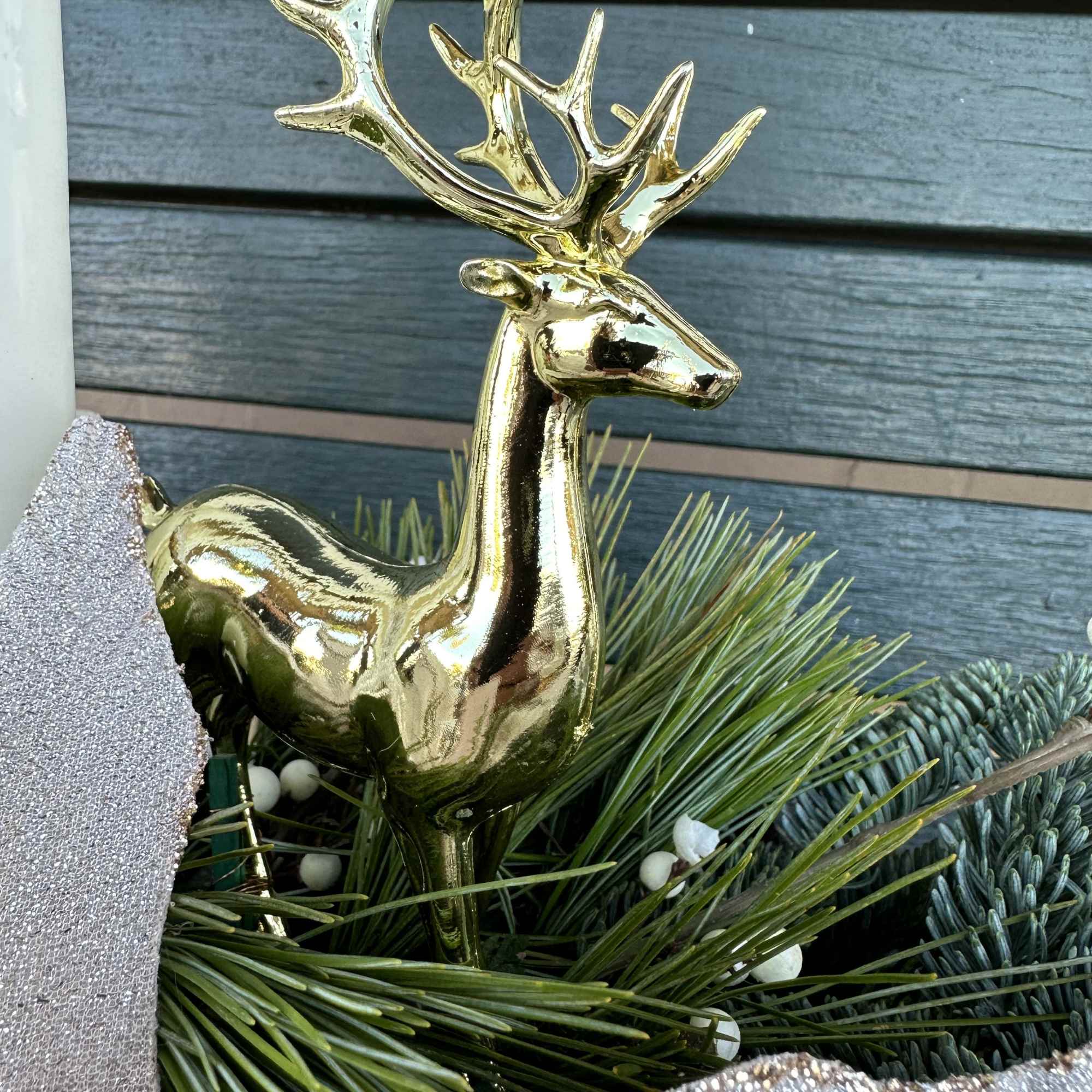 Elegant winter design by Chaney&lsquo;s with fresh Christmas greens, decoration and candles.