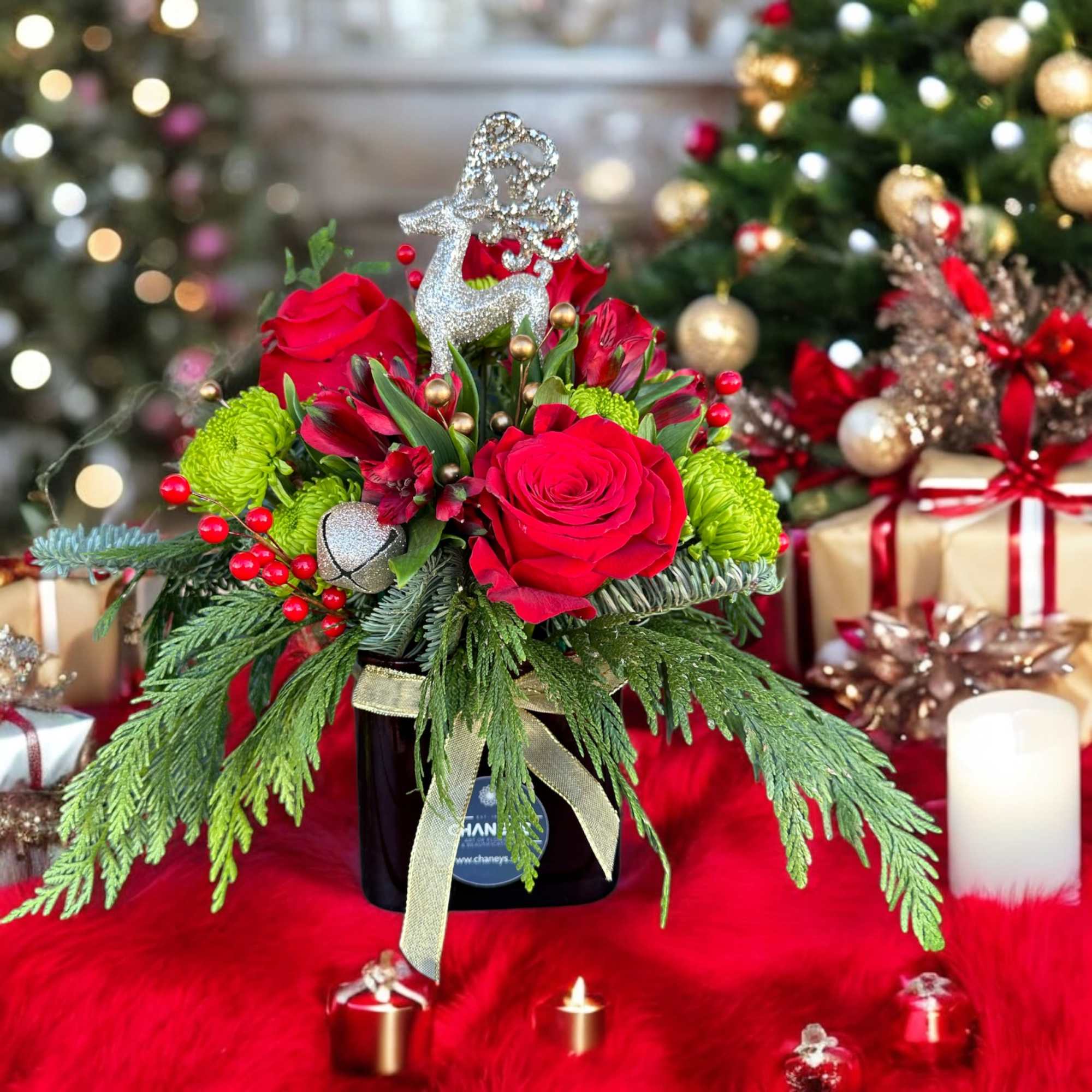 Beautiful seasonal design made with fresh Christmas greens and roses. Very decorative