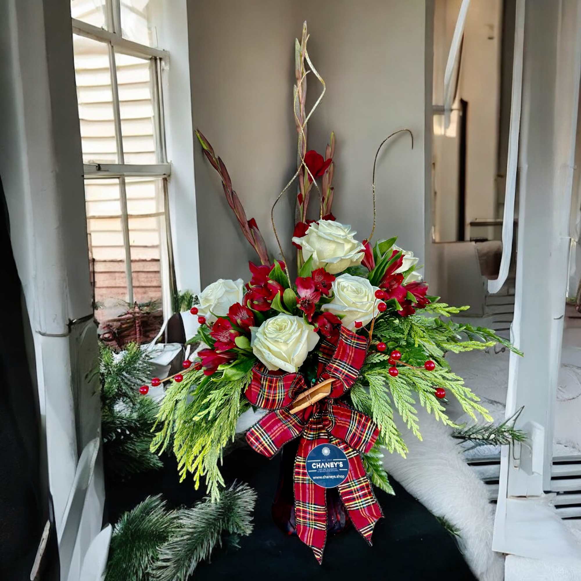 Grand floral fresh cut Christmas design in red white green and gold.