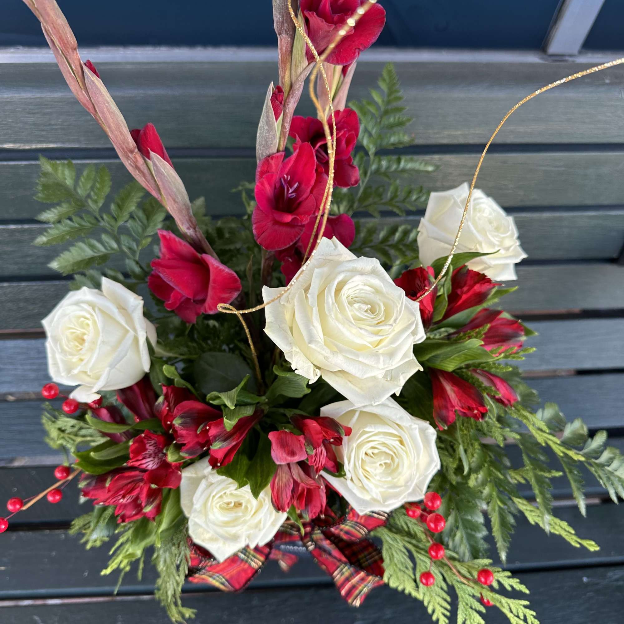 Grand floral fresh cut Christmas design in red white green and gold.