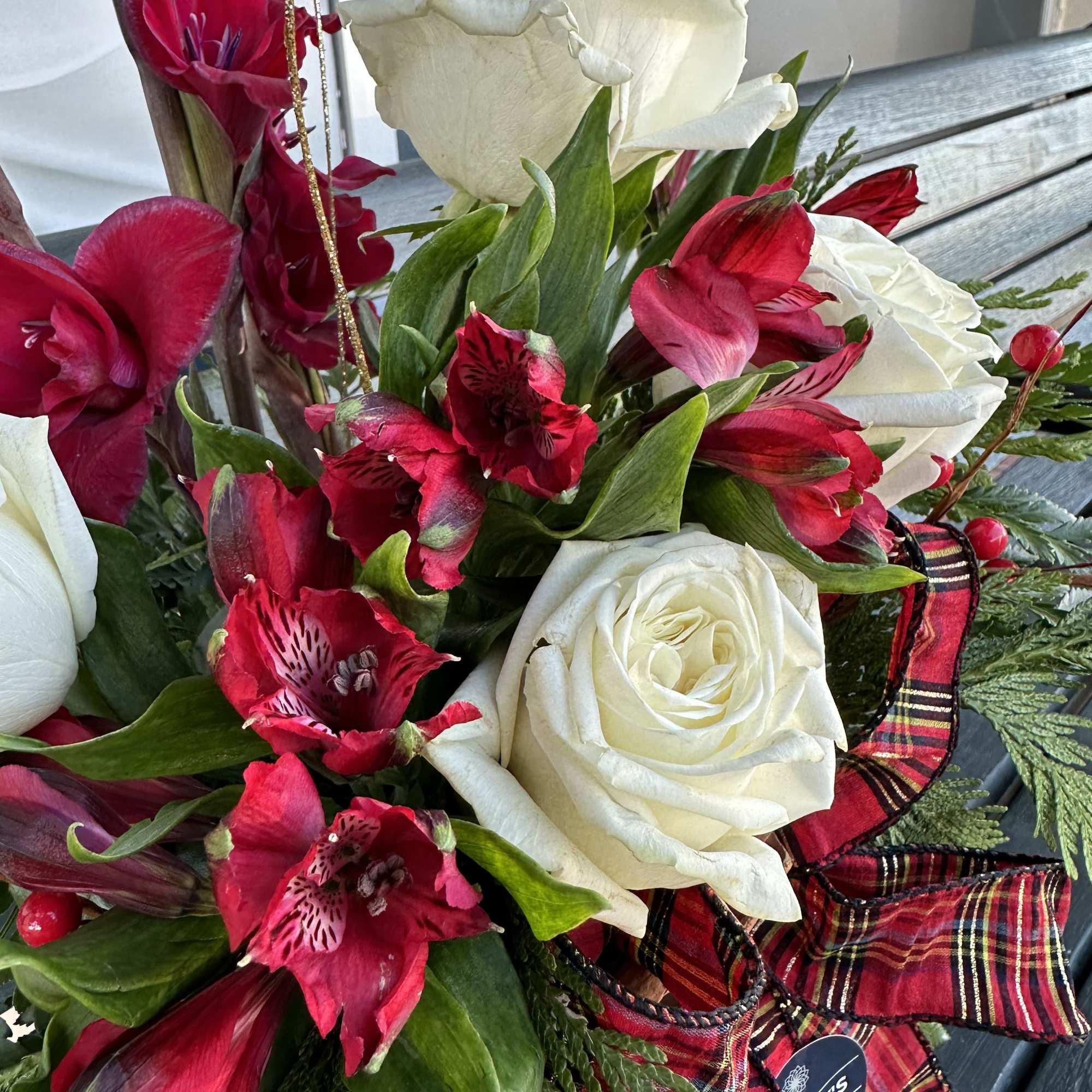 Grand floral fresh cut Christmas design in red white green and gold.