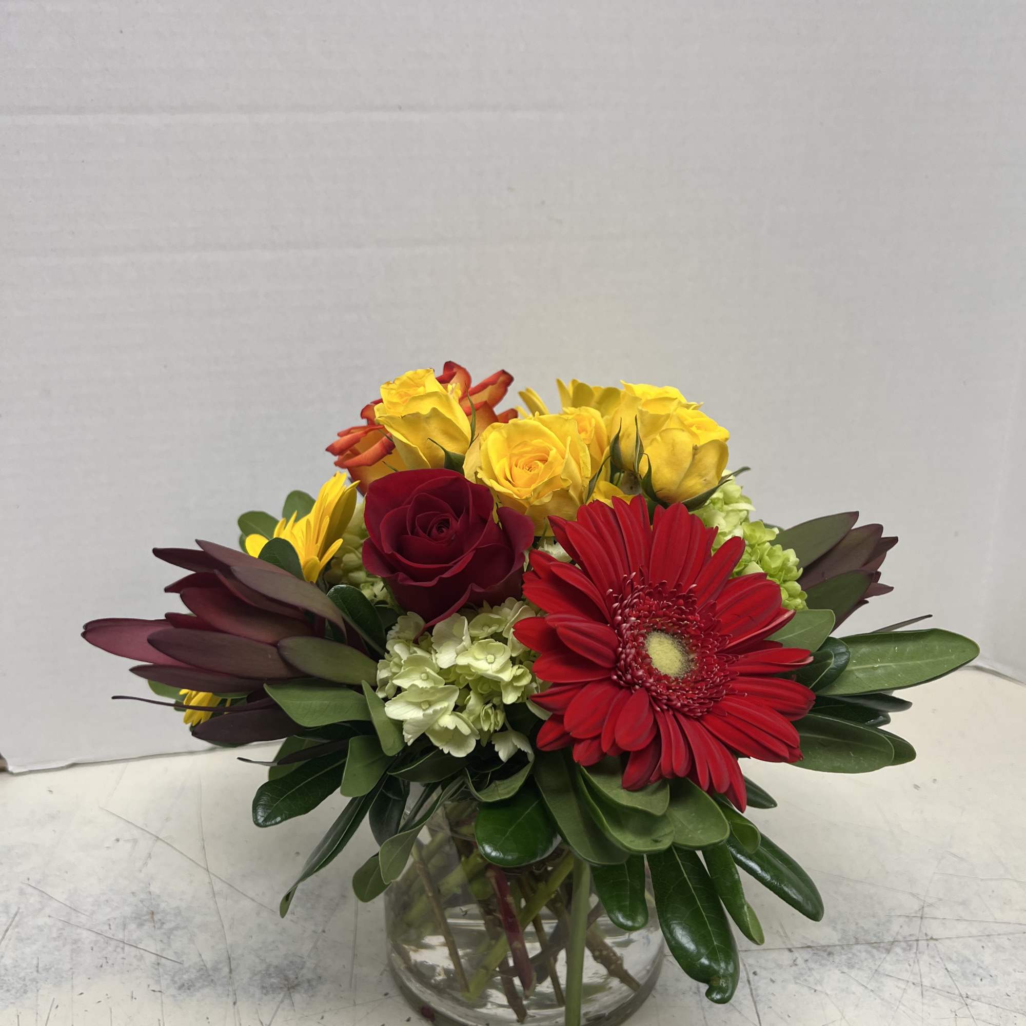 Low glass vase of fall flowers perfect for birthdays, get wells, and Low glass vase of fall flowers perfect for birthdays, get wells, and