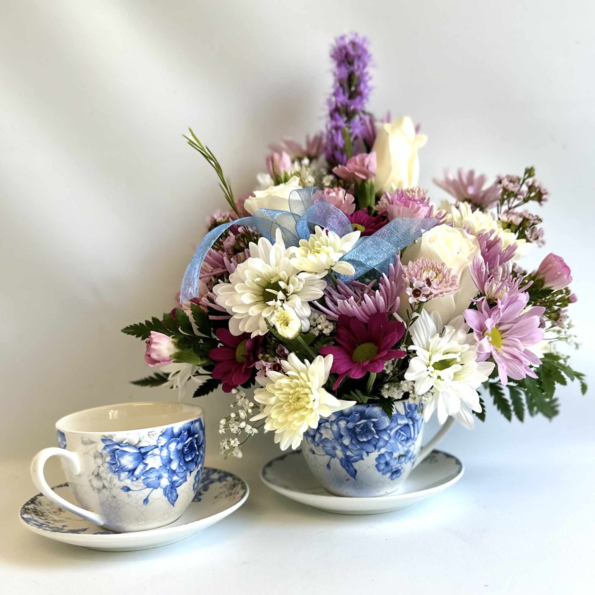 Teacup with a Blue English Rose design filled with a nice mix Teacup with a Blue English Rose design filled with a nice mix