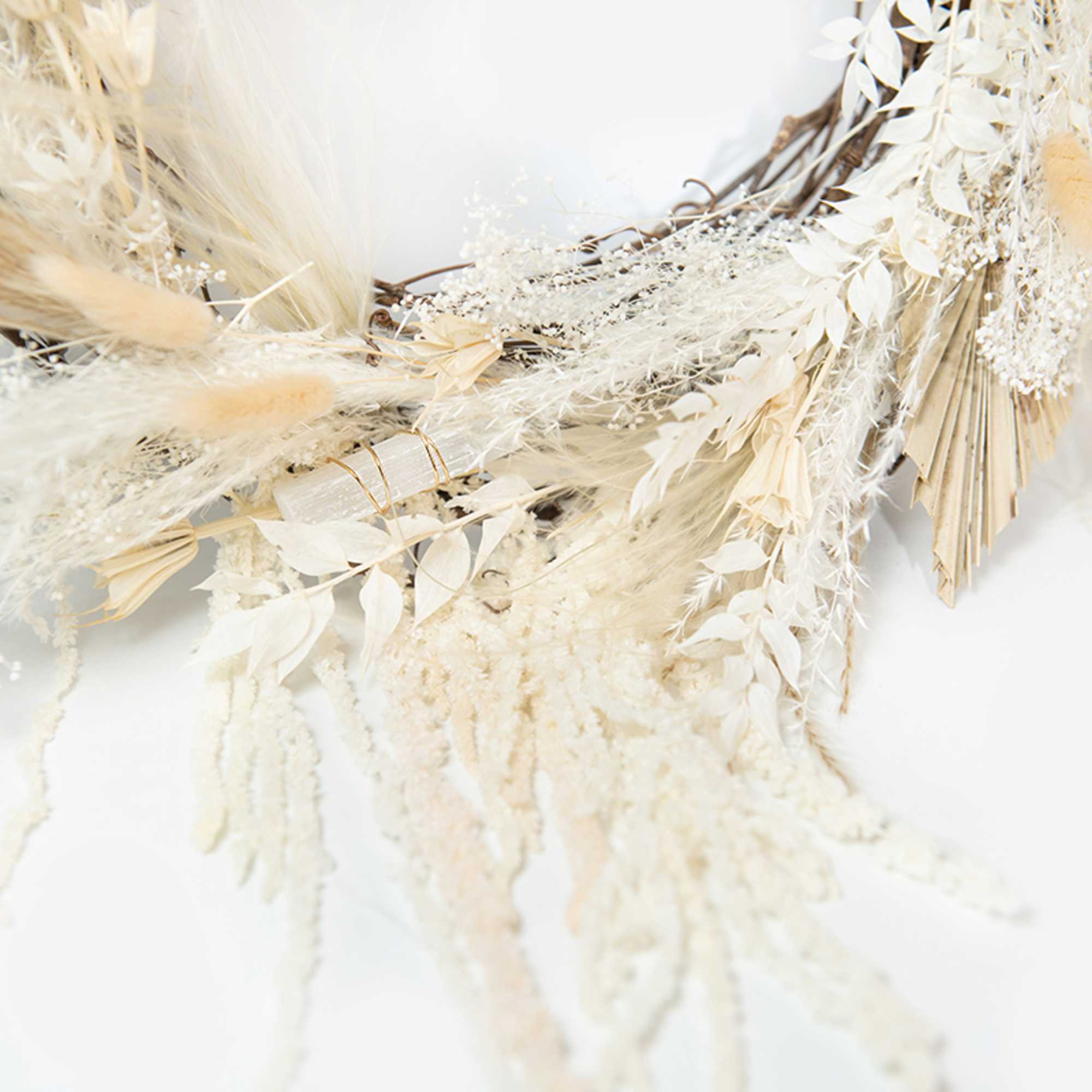 This hand-made full wreath includes an assortment of dried florals in shades