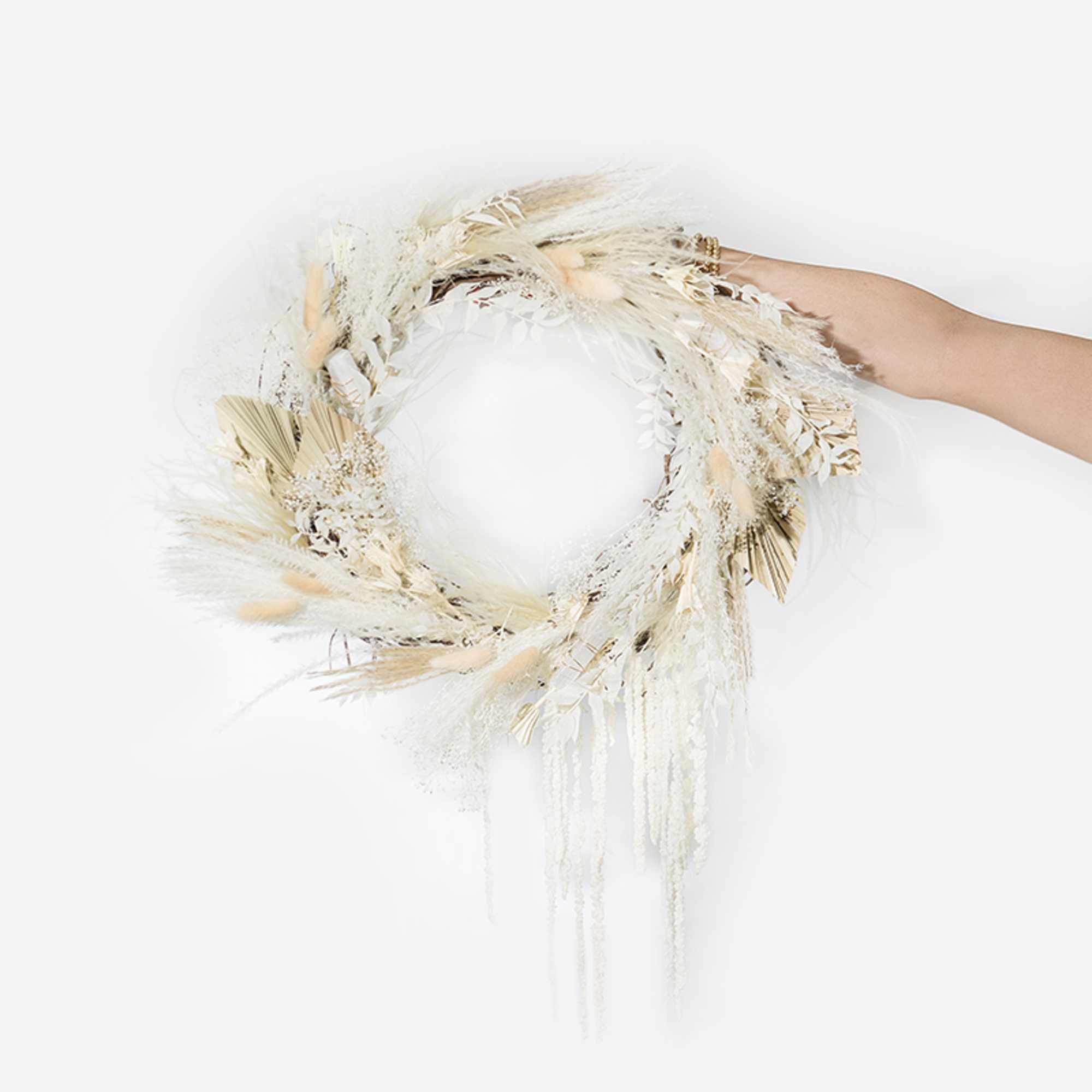 This hand-made full wreath includes an assortment of dried florals in shades