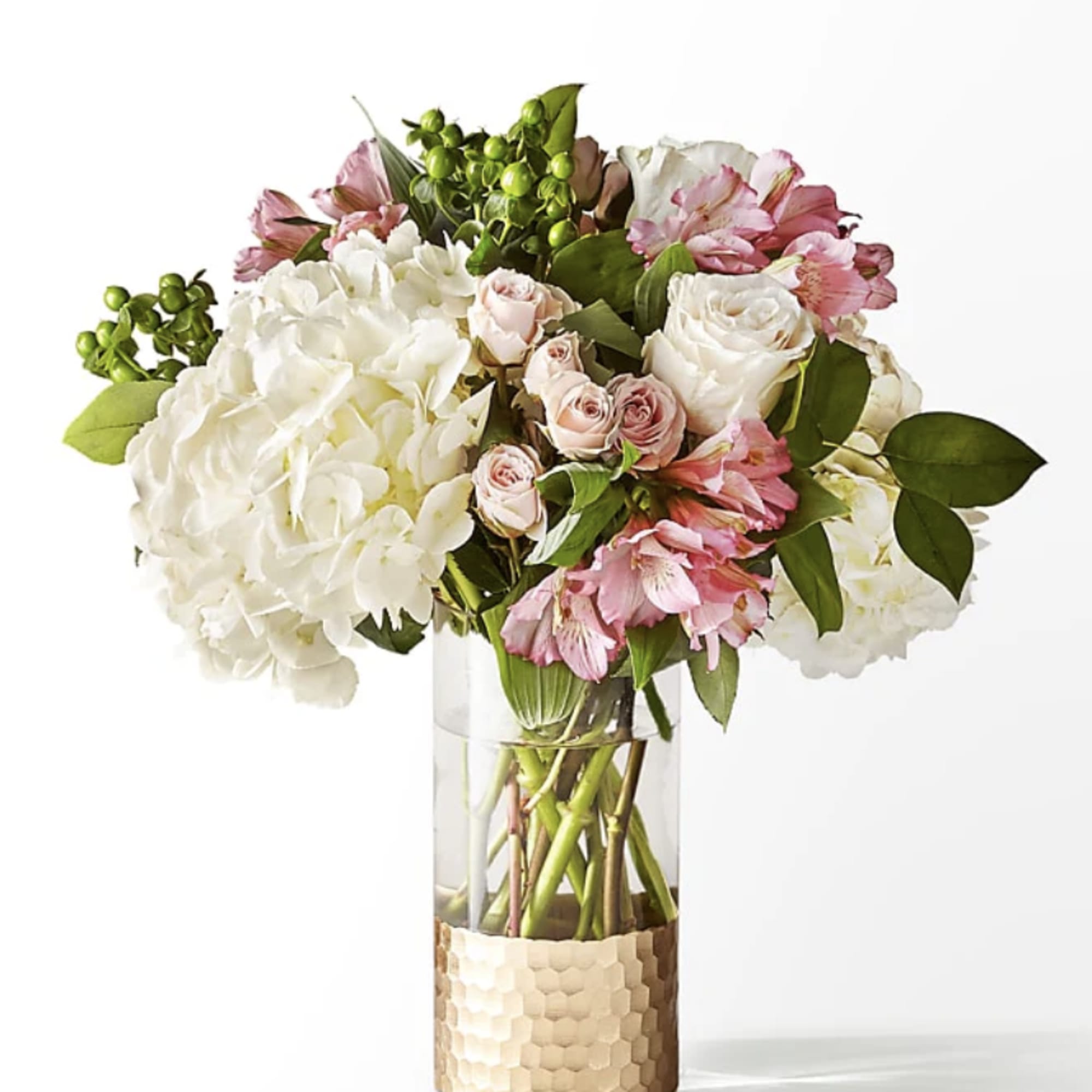 Capturing the essence of a cool spring day, this delicate arrangement is Capturing the essence of a cool spring day, this delicate arrangement is
