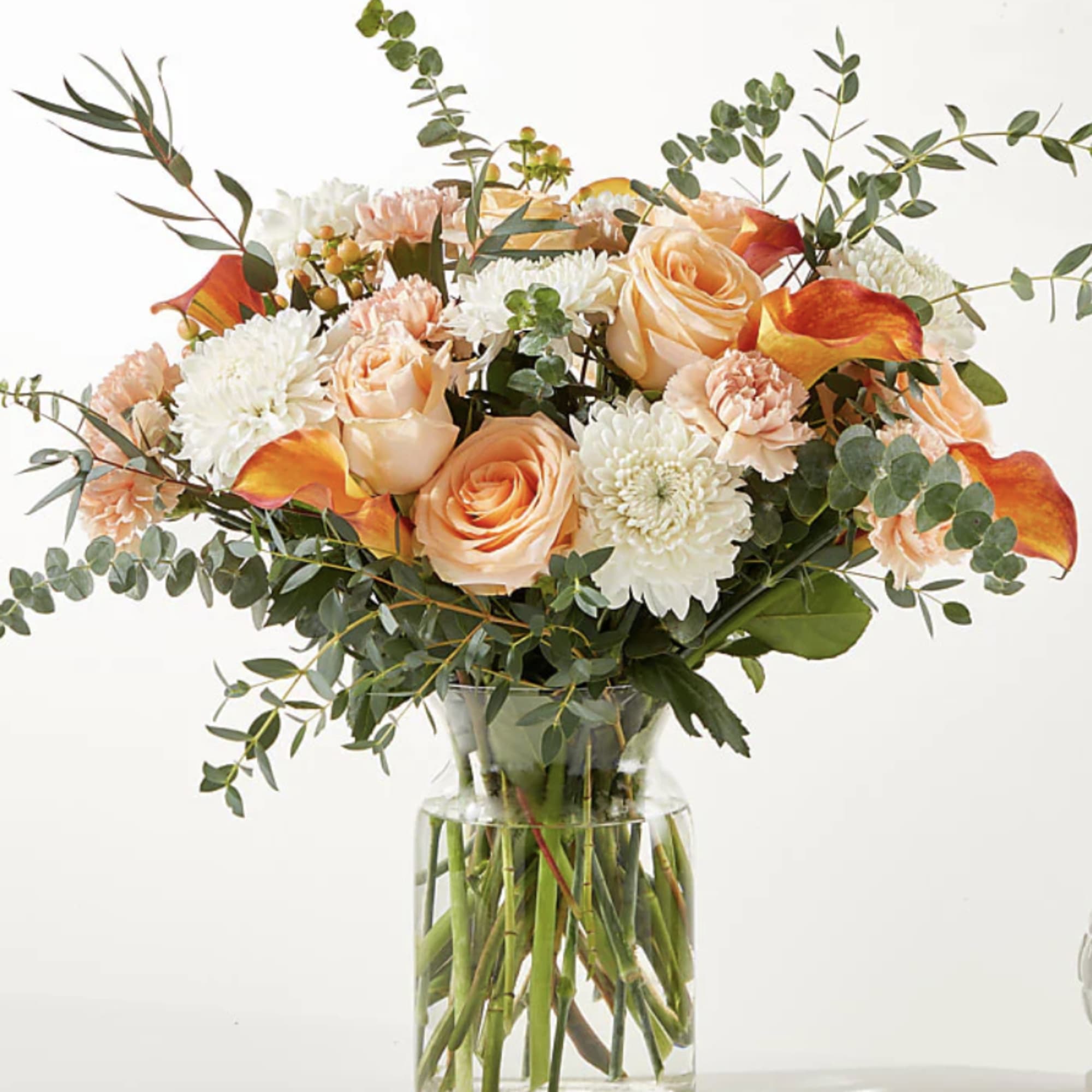 The As You Wish Bouquet is designed with white mums and orange The As You Wish Bouquet is designed with white mums and orange