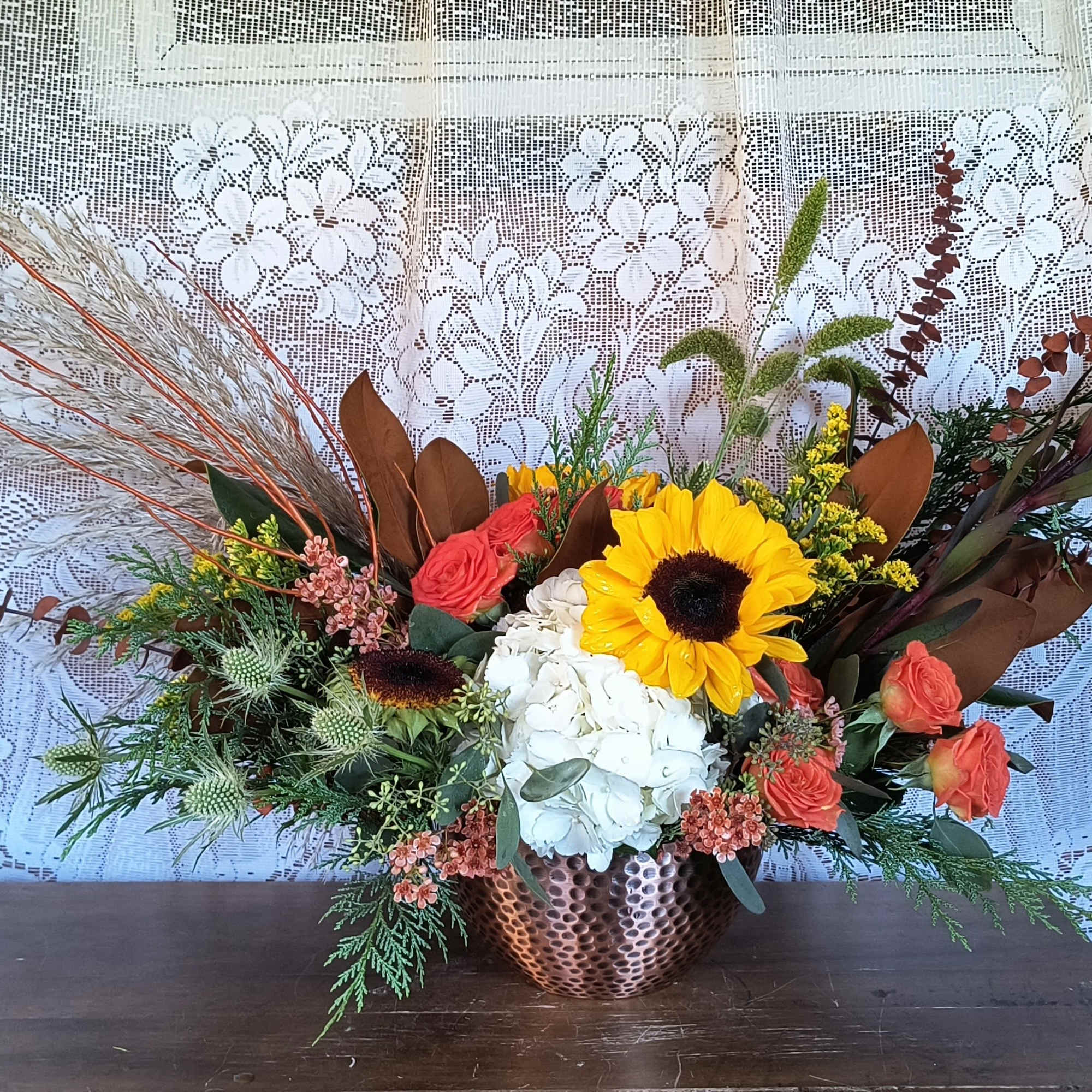 An eclectic arrangement of autumn materials in glorious seasonal colors and flowers. An eclectic arrangement of autumn materials in glorious seasonal colors and flowers.
