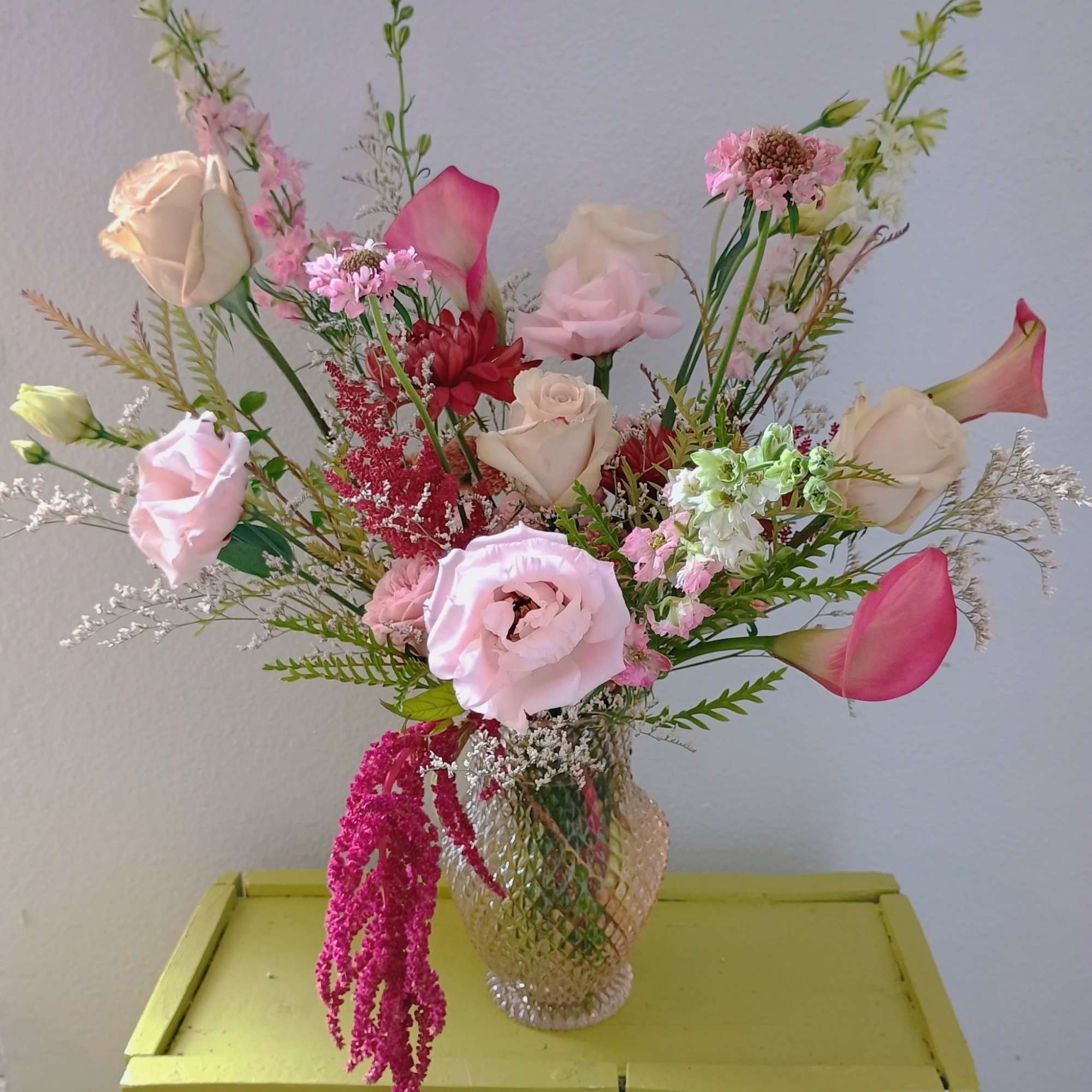 A feminine take on fall florals! Comes in a rose glass vase.