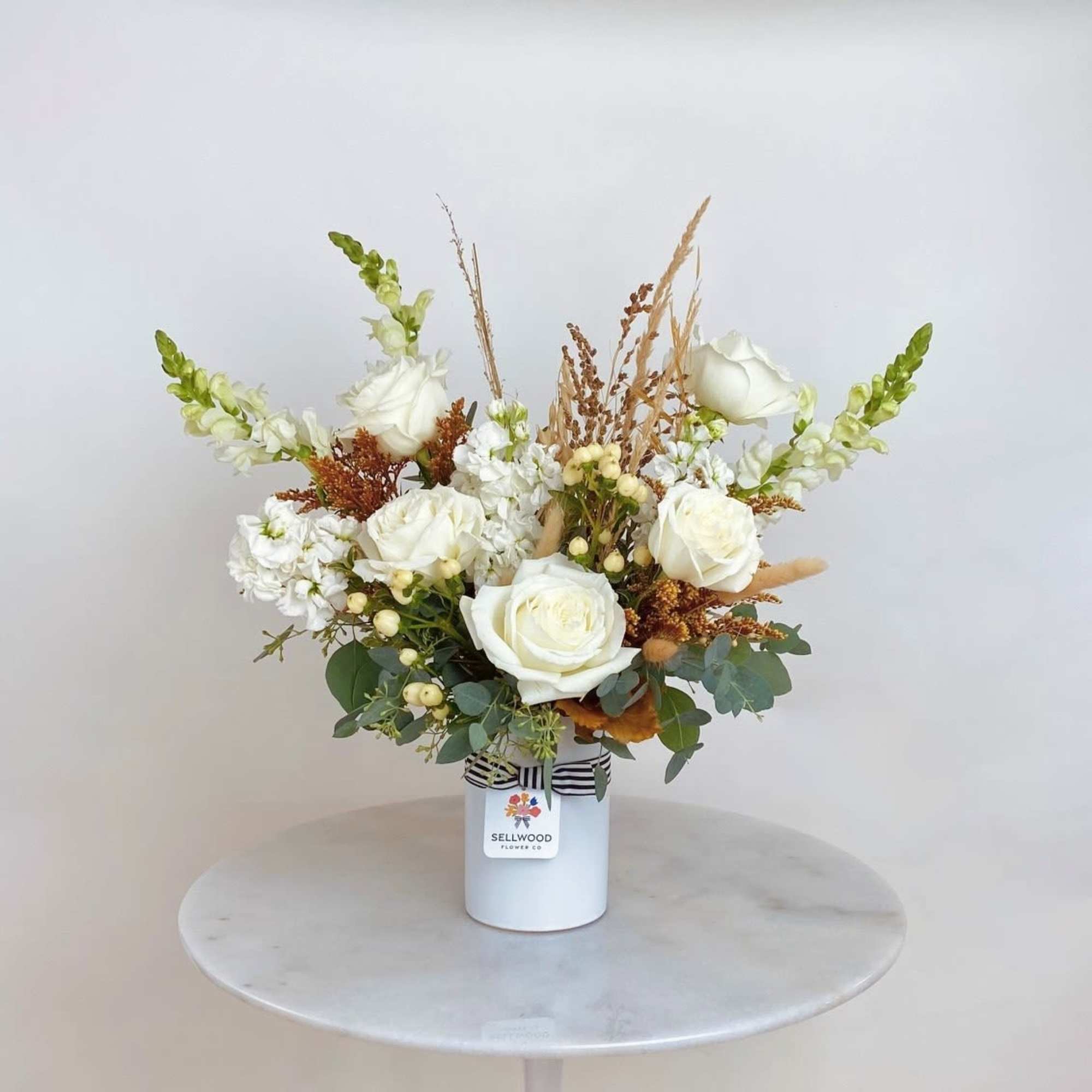Beautiful and simply elegant arrangement of all white blooms. 