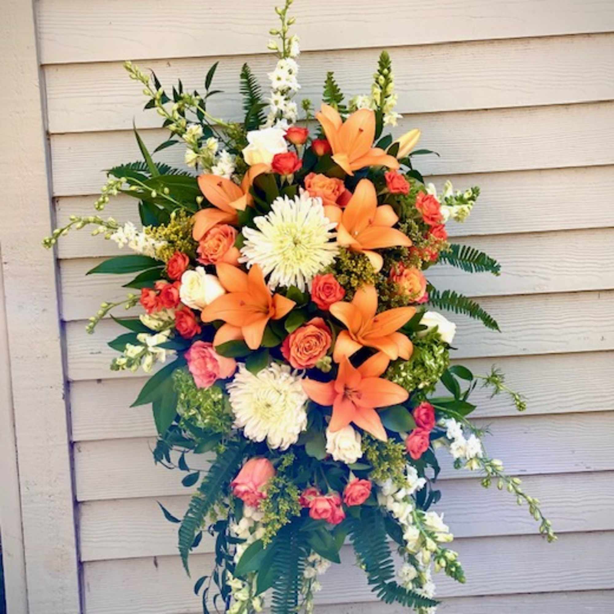 a colorful selection of seasonal blooms to celebrate the life of a