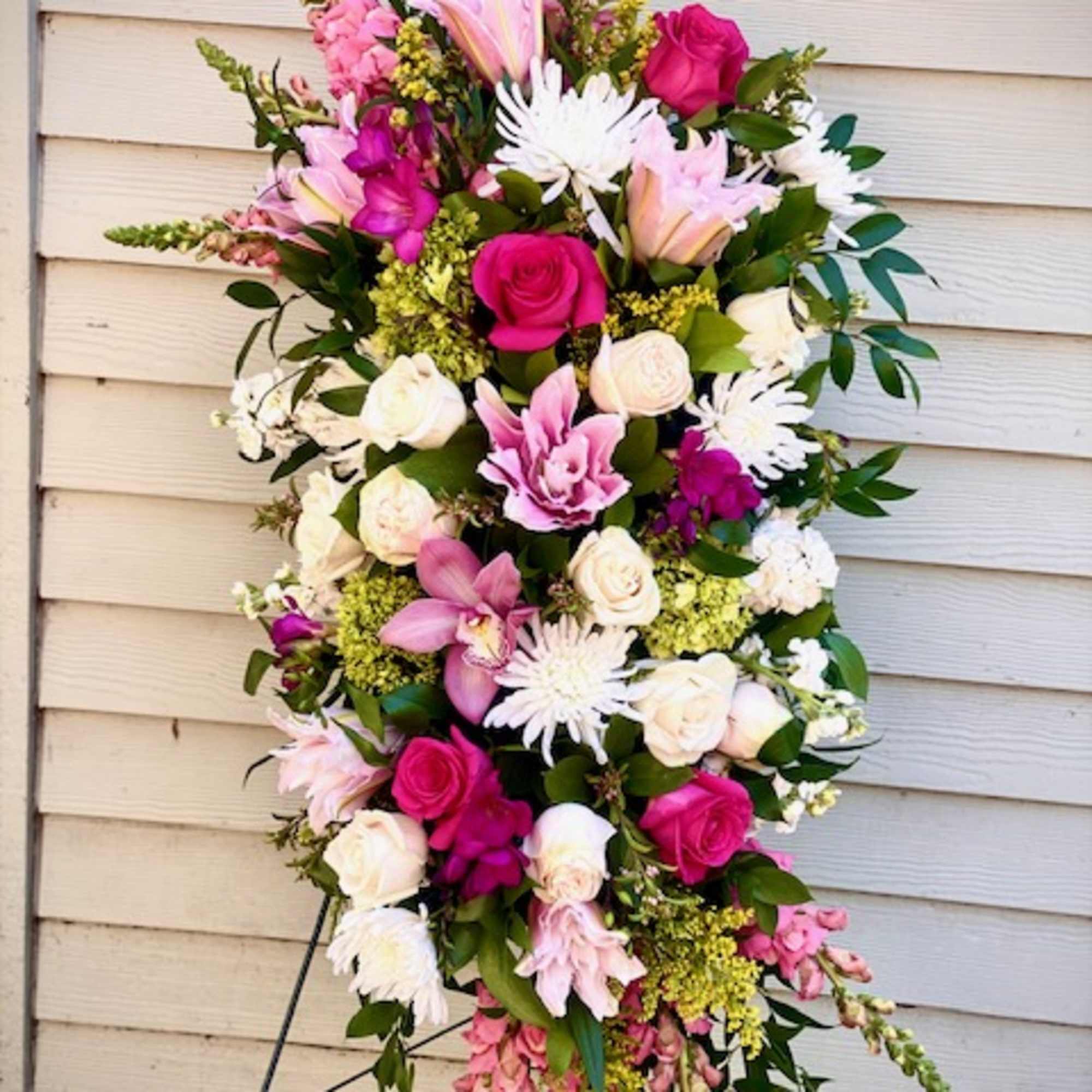 a colorful selection of seasonal blooms to celebrate the life of a