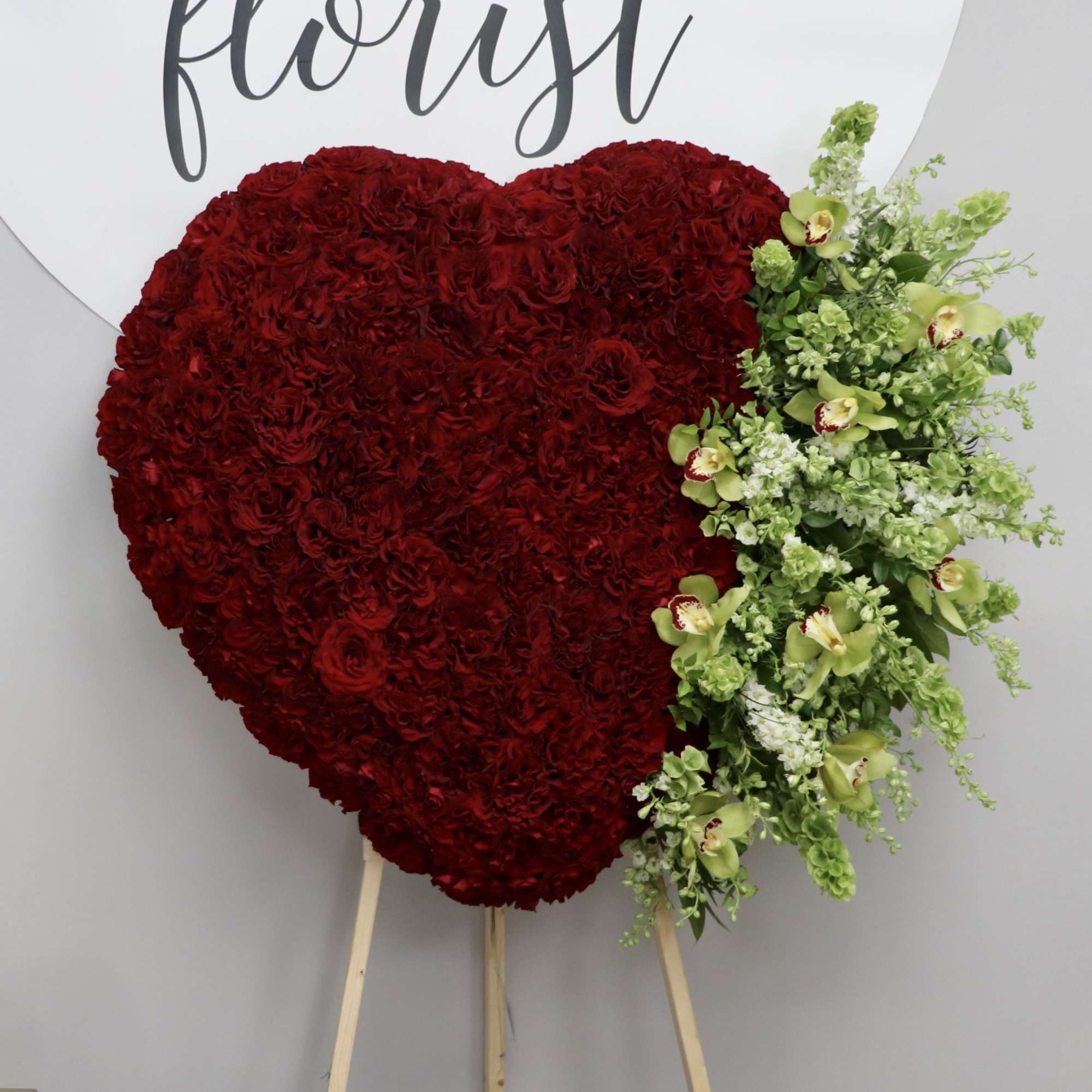 Red Roses and Orchids is all this heart desires. 

We include easel