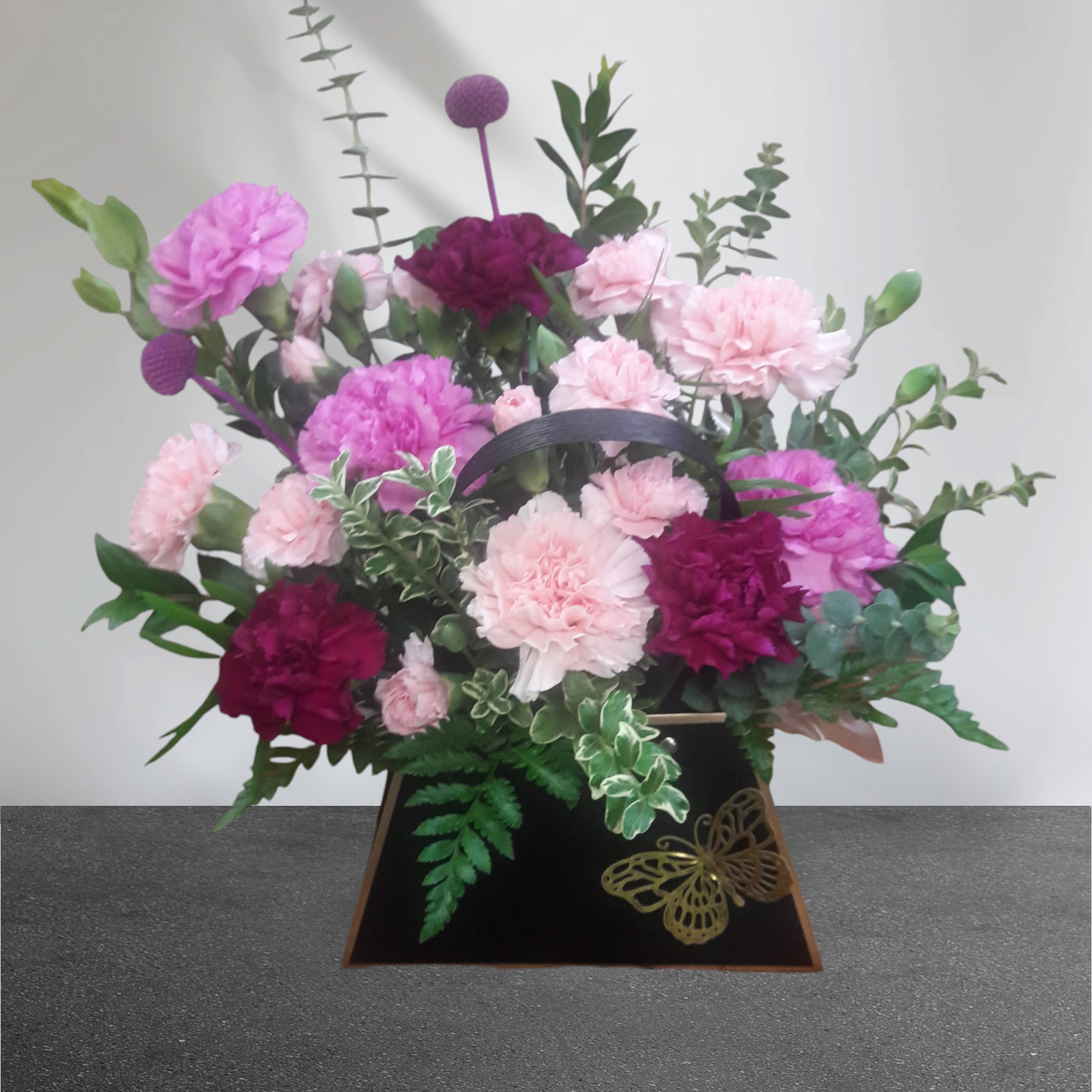 One-Of-A-Kind Purse filled to the brim with a plethora of colored carnations!

Please