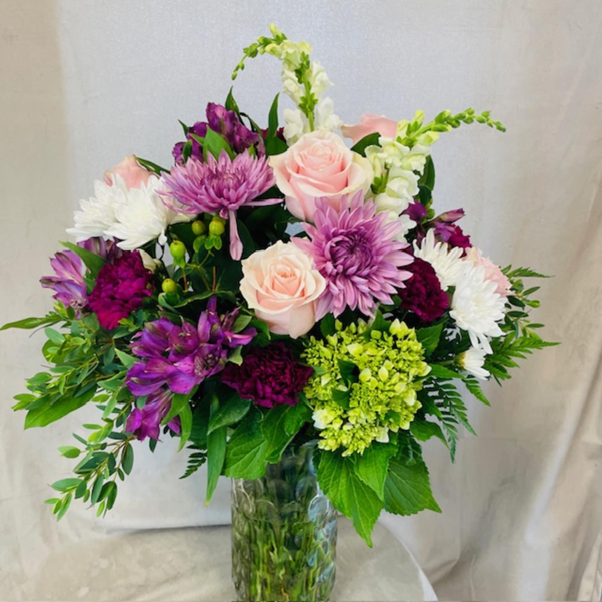 A selection of purples and pinks with a pop of green. This