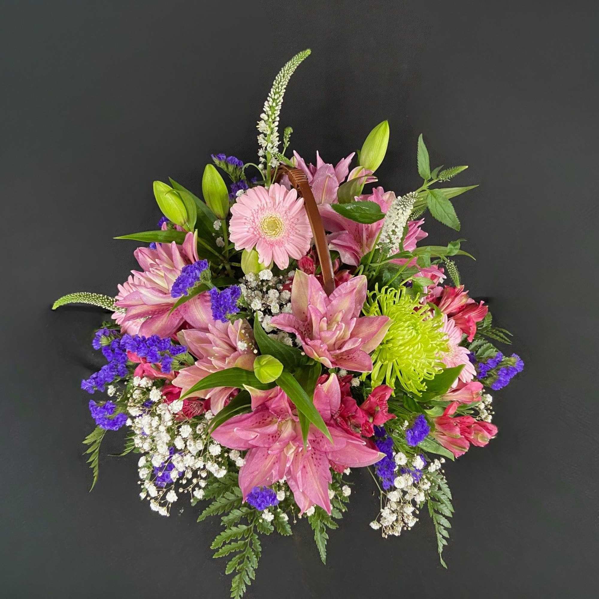 A delightful basket filled with fragrant flowers including Rose Lilies, Alstroemeria, Gerbera A delightful basket filled with fragrant flowers including Rose Lilies, Alstroemeria, Gerbera