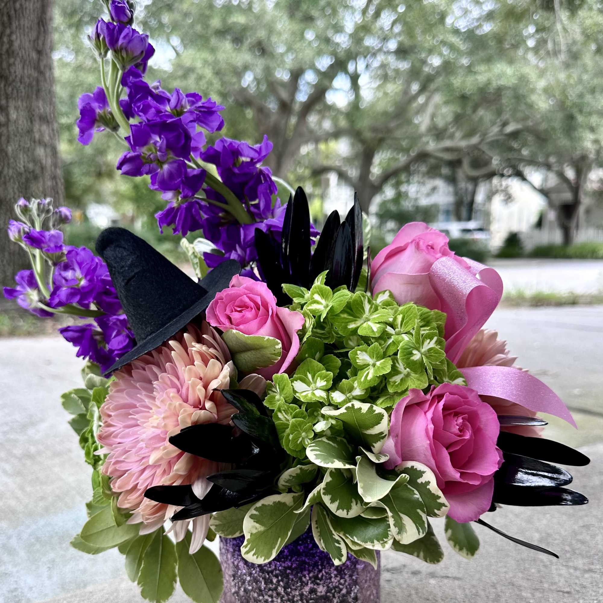 Cast a spell this season with our enchanting Wicked Blooms arrangement. Inspired Cast a spell this season with our enchanting Wicked Blooms arrangement. Inspired