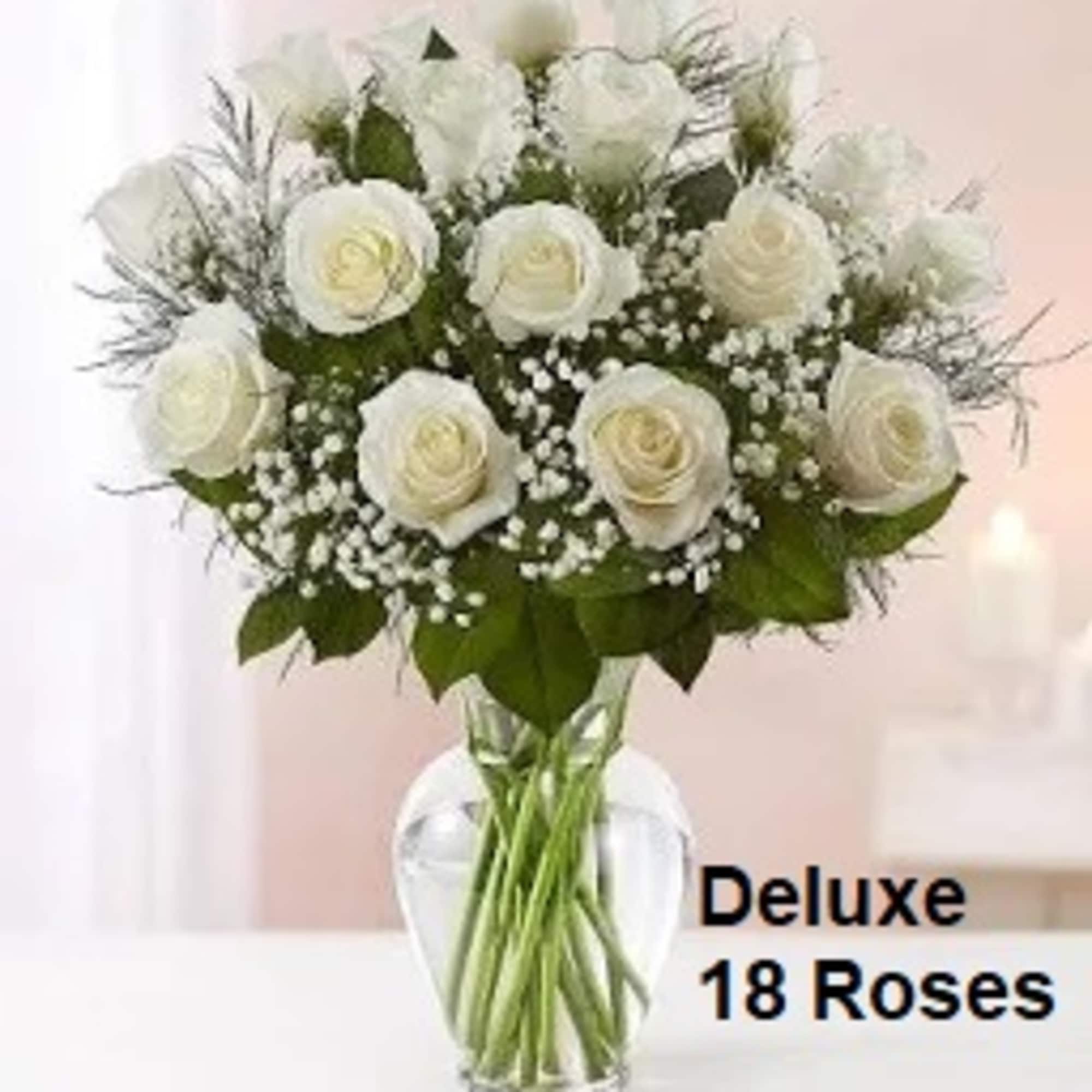 Standard: 12 White Roses arranged in a vase.
Deluxe: 18 White Roses and Standard: 12 White Roses arranged in a vase.
Deluxe: 18 White Roses and